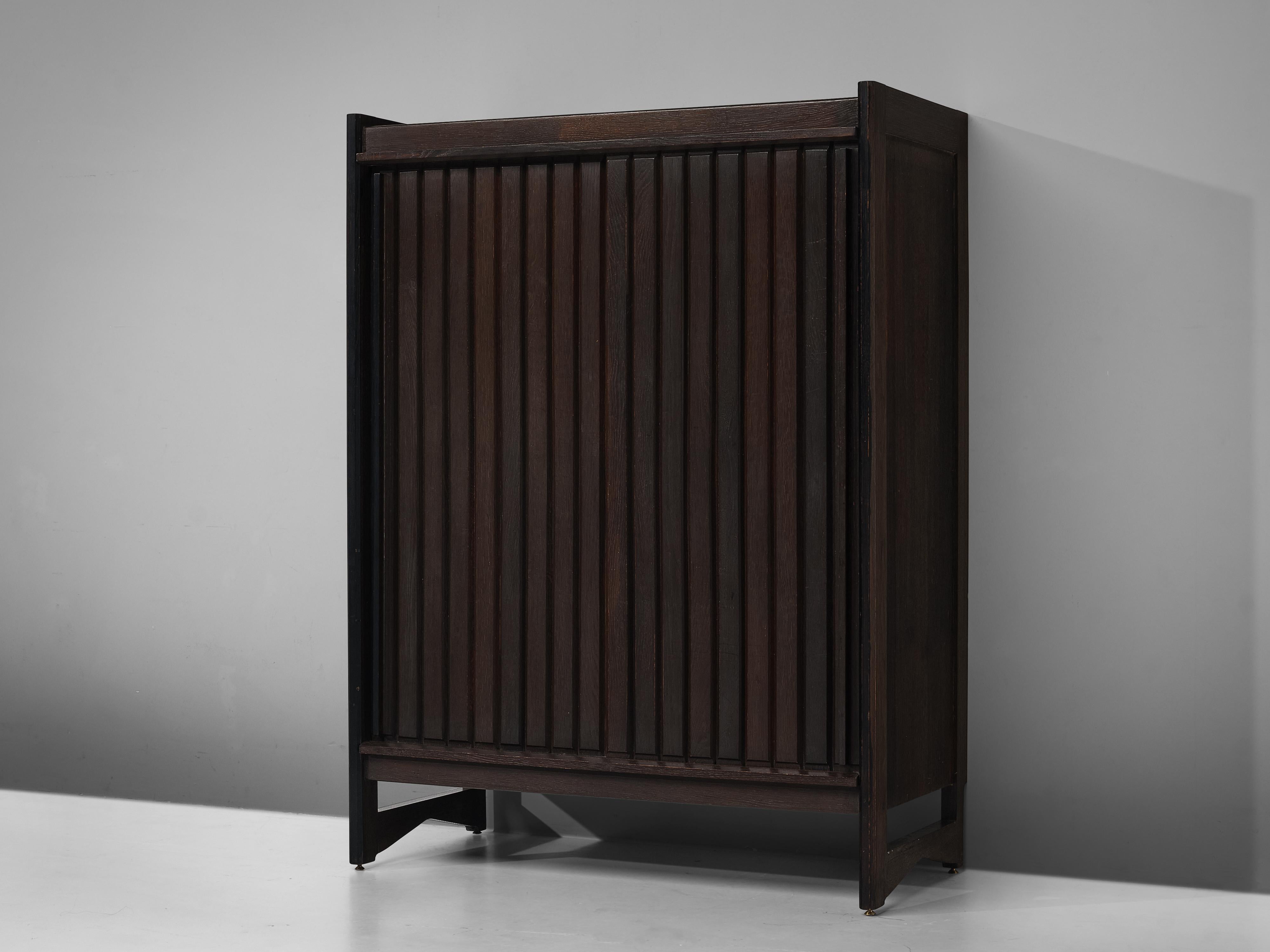 Guillerme & Chambron, cabinet, oak, France, 1960s

This sculptural cabinet is made by the designer duo Guillerme & Chambron. The piece is executed in solid, stained oak and features sculptural lines and edges. The design consists out of two larger