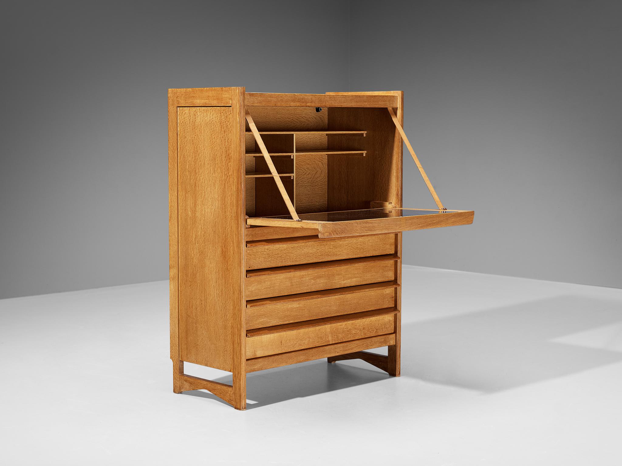 Guillerme et Chambron for Votre Maison, cabinet with secretaire, oak, leather, France, 1960s

This sculptural cabinet is made by the designer duo Guillerme & Chambron. The piece is executed in solid oak and features sculptural lines and edges. The