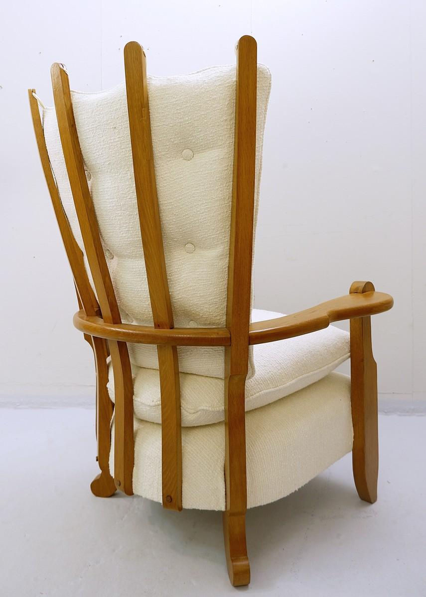 Guillerme & Chambron carved oak high back armchair, new upholstery.