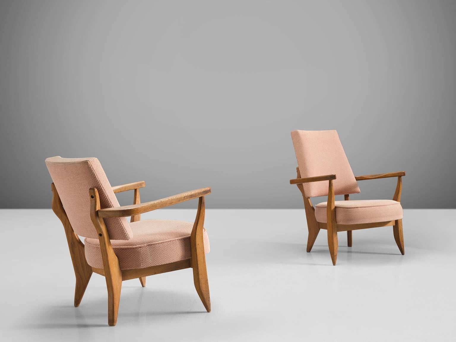 Jacques Chambron and Robert Guillerme, Him and Hir easy chairs, beige and pink fabric, oak, France, 1950s

This sculptural set of easy chairs by Guillerme and Chambron is very well executed and made out of solid, carved blond oak. This set of