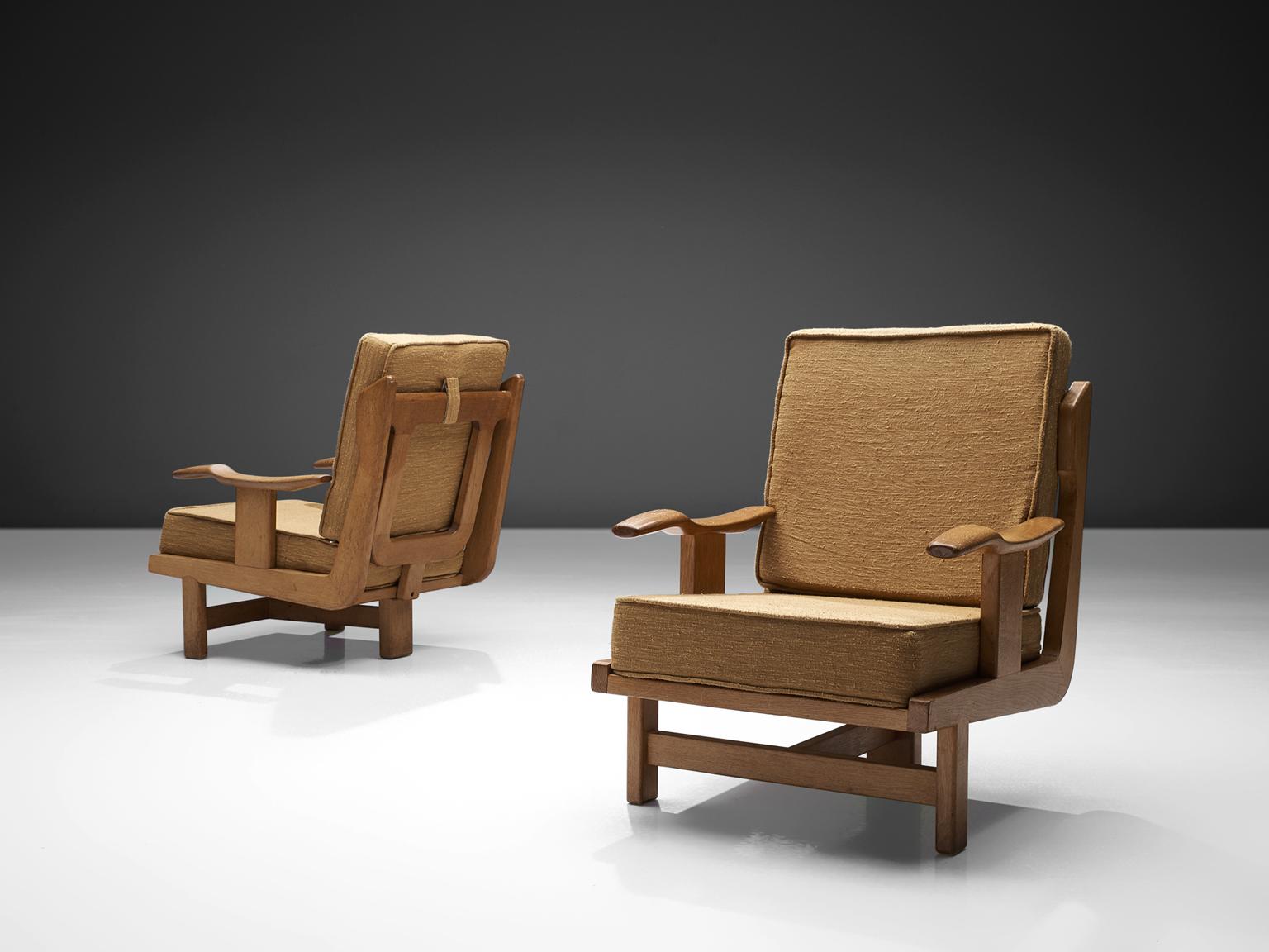 Guillerme & Chambron, oak chairs with ocre yellow fabric upholstery, France, 1960s.

These chairs have a very interesting back and show a variety of stunning shapes and well designed lines, such as the armrest and the elegant softly edged square