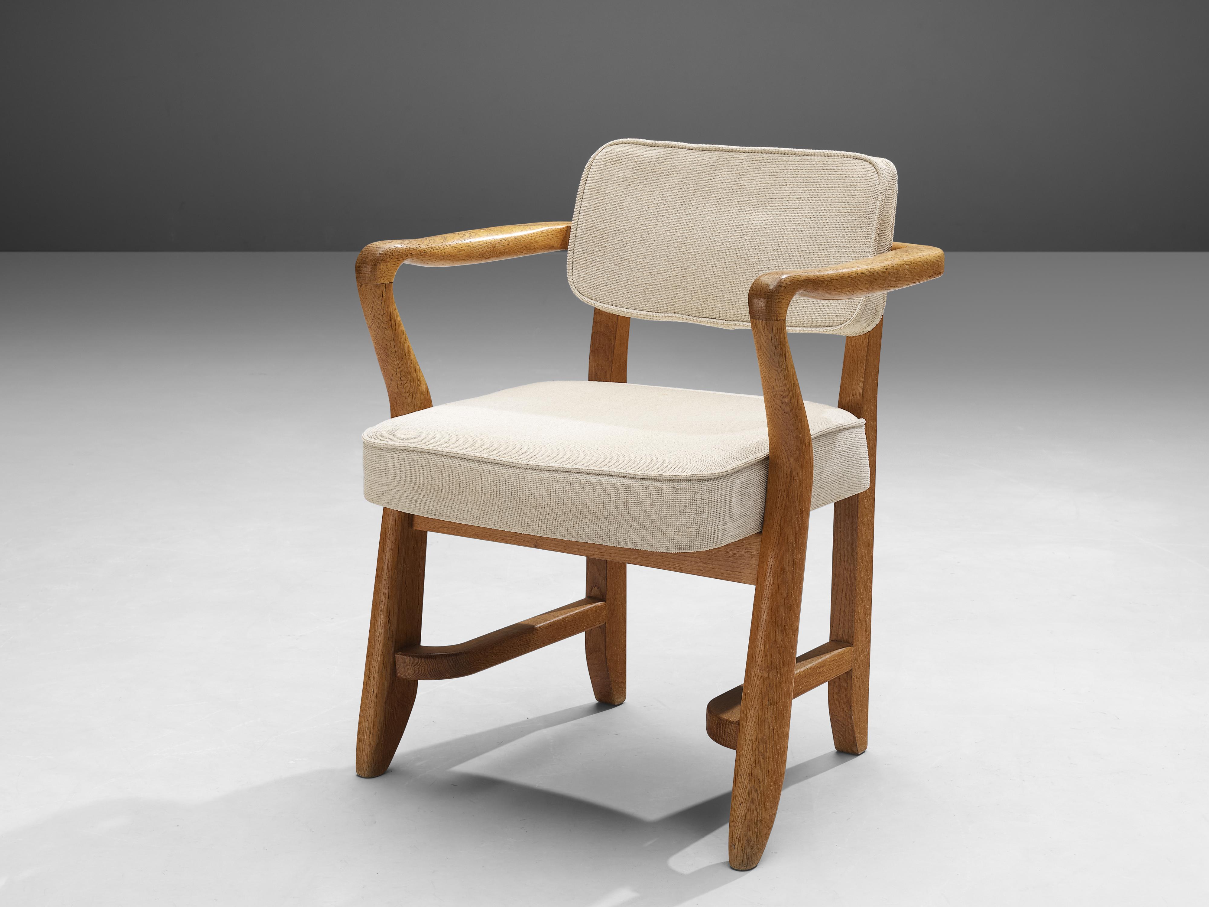 Guillerme & Chambron, 'Denis' armchairs, fabric, oak, France, 1950s

This sculptural easy chair is designed by Guillerme & Chambron. The duo is known for their high quality solid oak furniture. The sculptural armchair has an interesting open