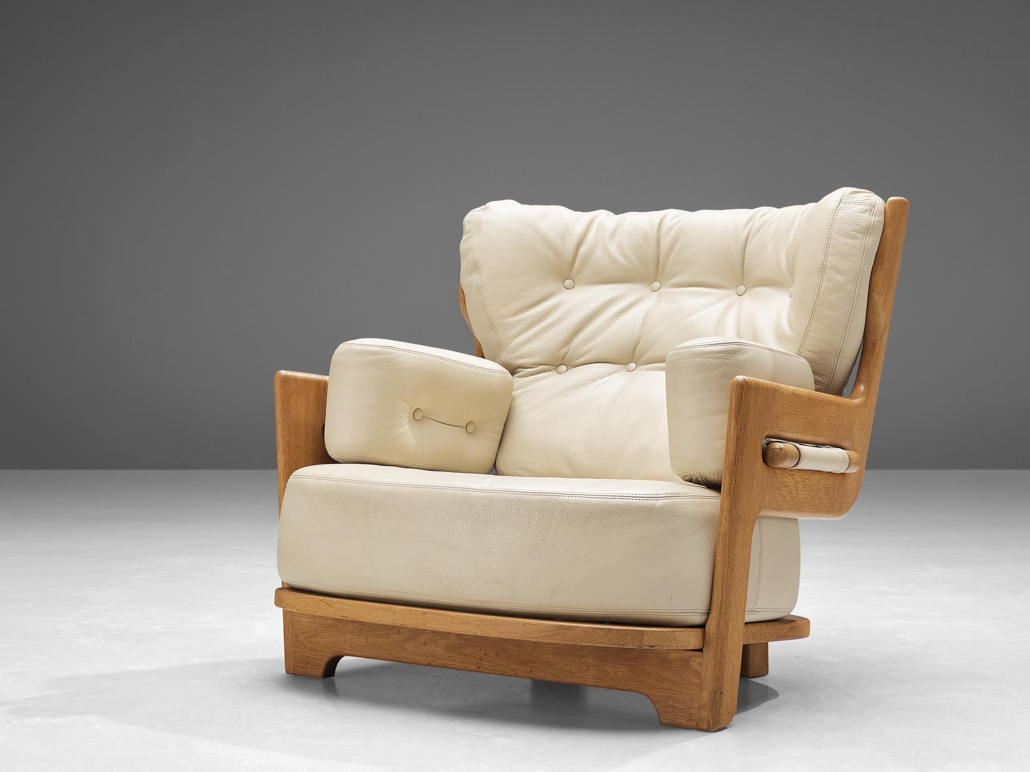 French Guillerme & Chambron 'Denis' Lounge Chair in Solid Oak and Leather  For Sale