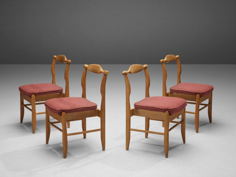 Guillerme et Chambron, dining chairs model 'Fumay', oak, fabric, France, 1960s

Beautifully shaped chairs in patinated oak by French designer duo Jacques Chambron and Robert Guillerme. These dining chairs show beautiful lines in every element. The