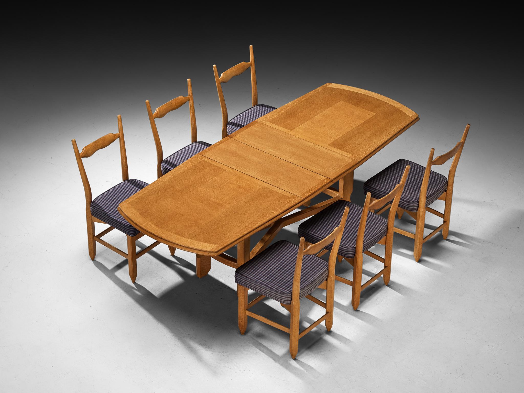 Guillerme et Chambron for Votre Maison, set of six 'Charles' dining chairs and table, solid oak, fabric, France, 1960s

Lovely dining set designed by duo Guillerme and Chambron in the 1960s. The Charles chair, designed in the 1960s by the French duo