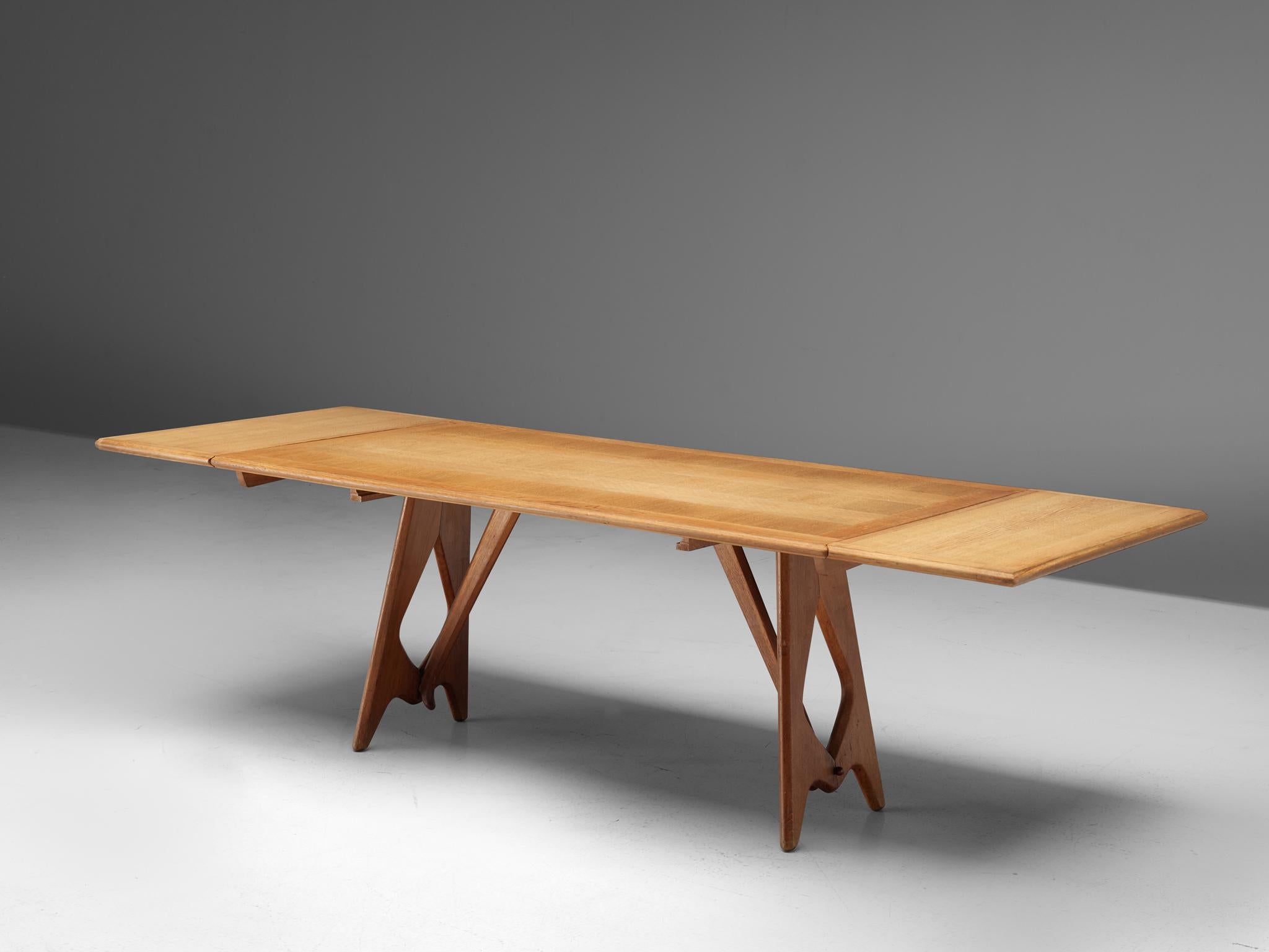 Guillerme et Chambron, dining table, oak, France, 1965.

Extendable dining table by French designer duo Jacques Chambron and Robert Guillerme. The legs of this table are beautifully shaped and show nice organic forms. The top is rectangular with to