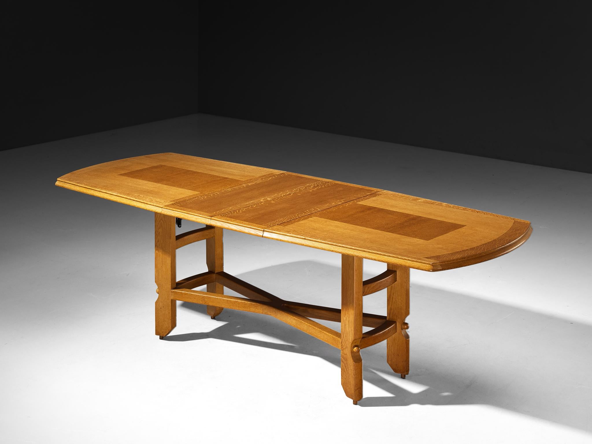 Guillerme et Chambron for Votre Maison, extendable dining table, solid oak, France, 1960s

This dining table, crafted from solid oak, is the work of renowned French design duo Jacques Chambron and Robert Guillerme. Exemplifying their signature