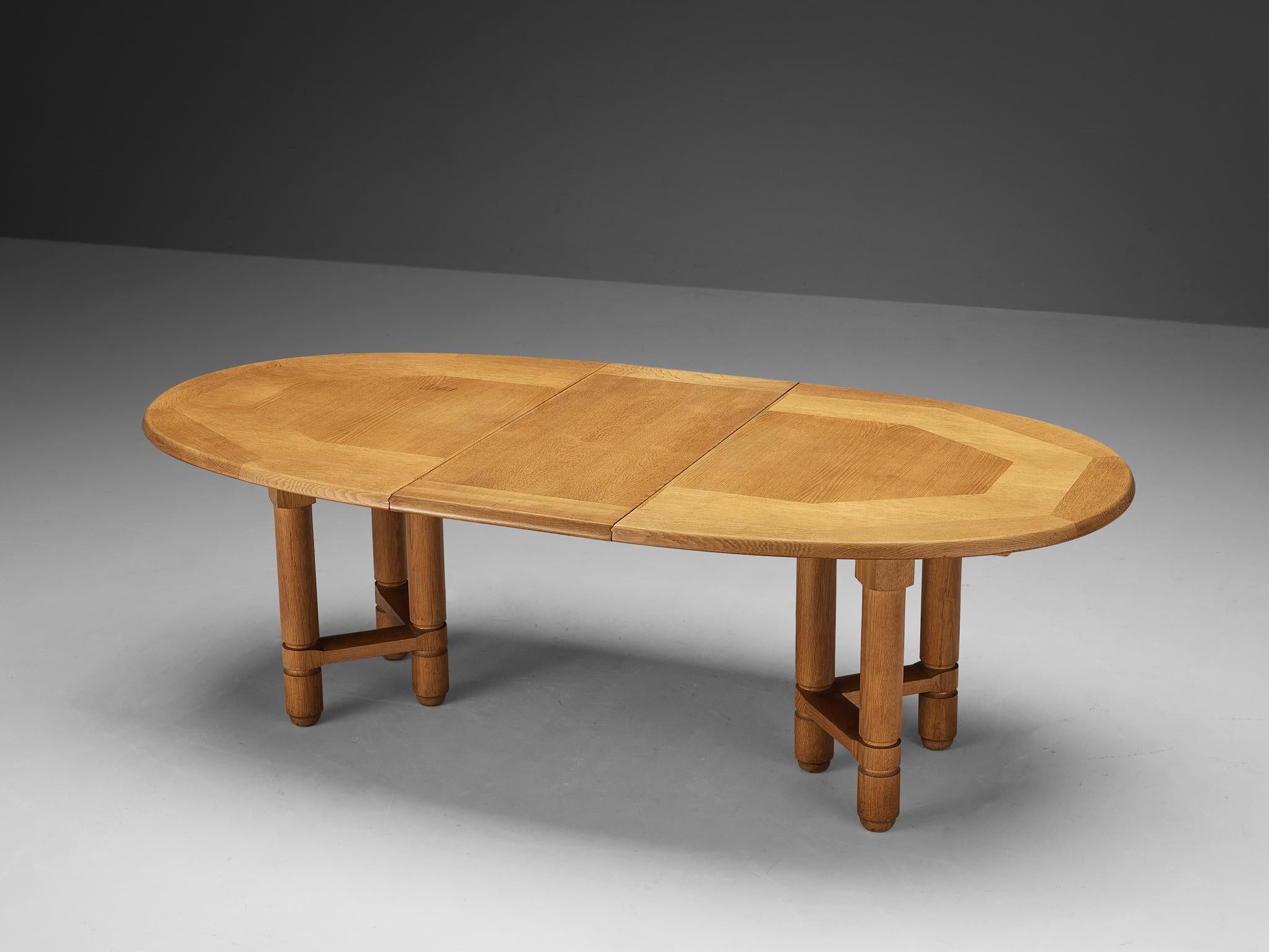 Guillerme et Chambron for Votre Maison, 'Elmyre' extendable dining table, solid oak, France, 1960s

This dining table, designed by the esteemed French duo Guillerme et Chambron, exemplifies superb craftsmanship and refined taste for elegant
