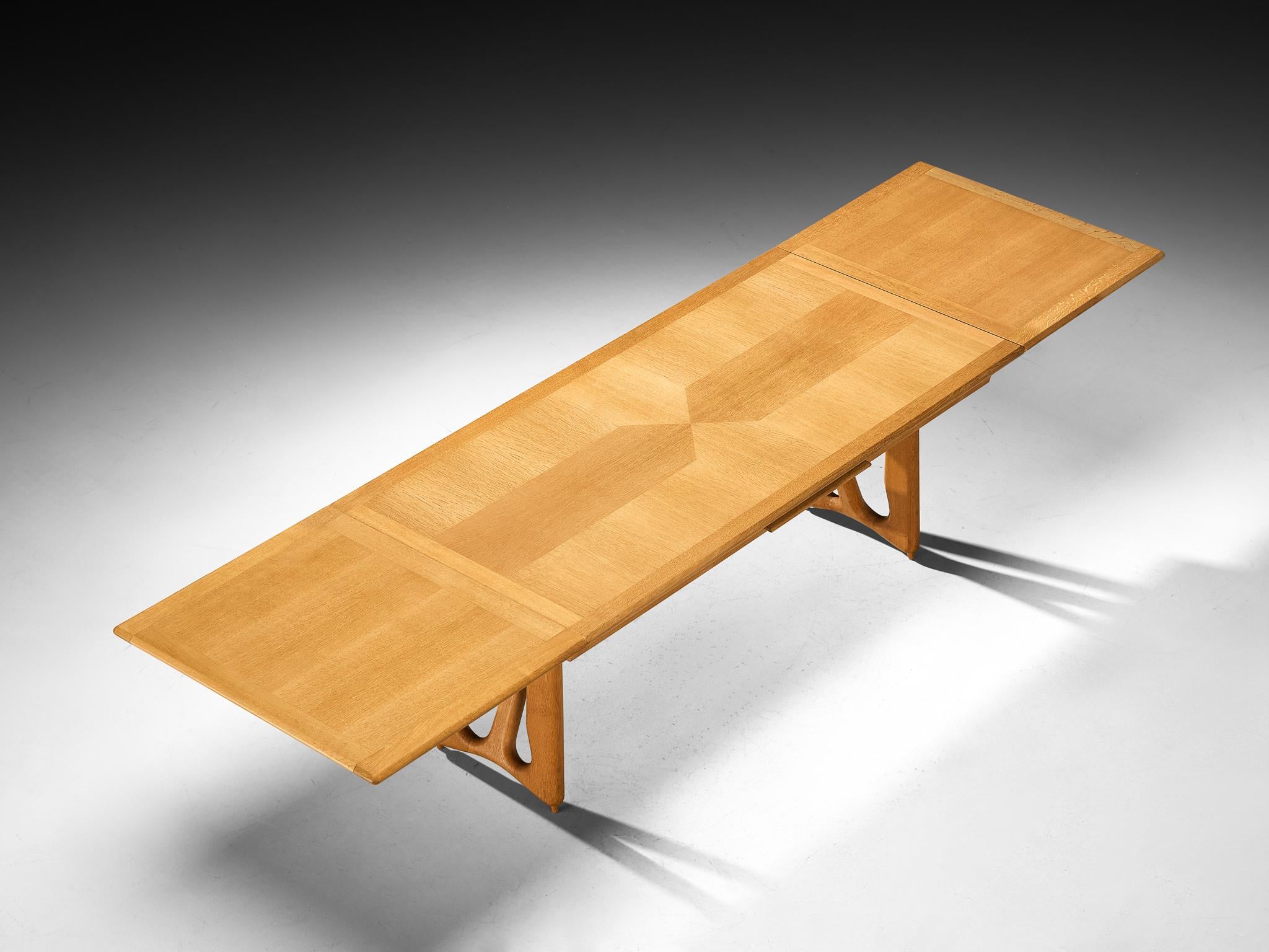 Guillerme et Chambron for Votre Maison, dining table, model 'L'Italienne', solid oak, France, 1960s

This L'Italienne dining room table is designed by the acclaimed French designer duo Jacques Chambron and Robert Guillerme. The legs of this table