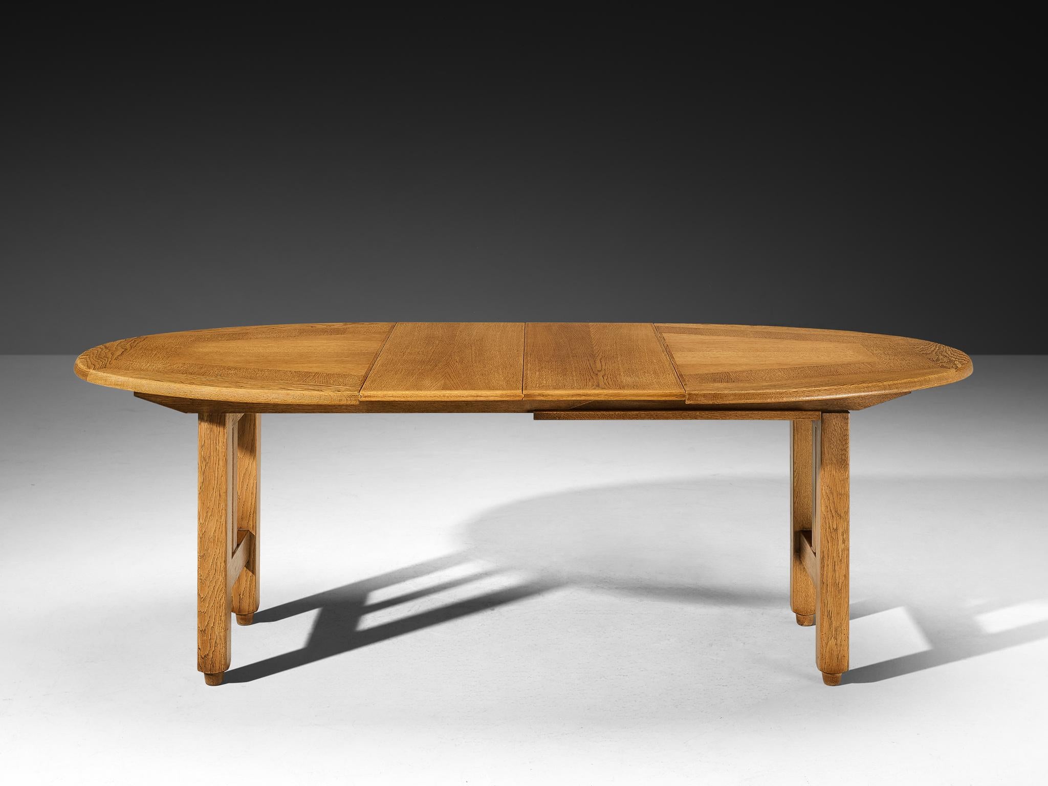 French Guillerme & Chambron Extendable Round Dining Table in Oak For Sale