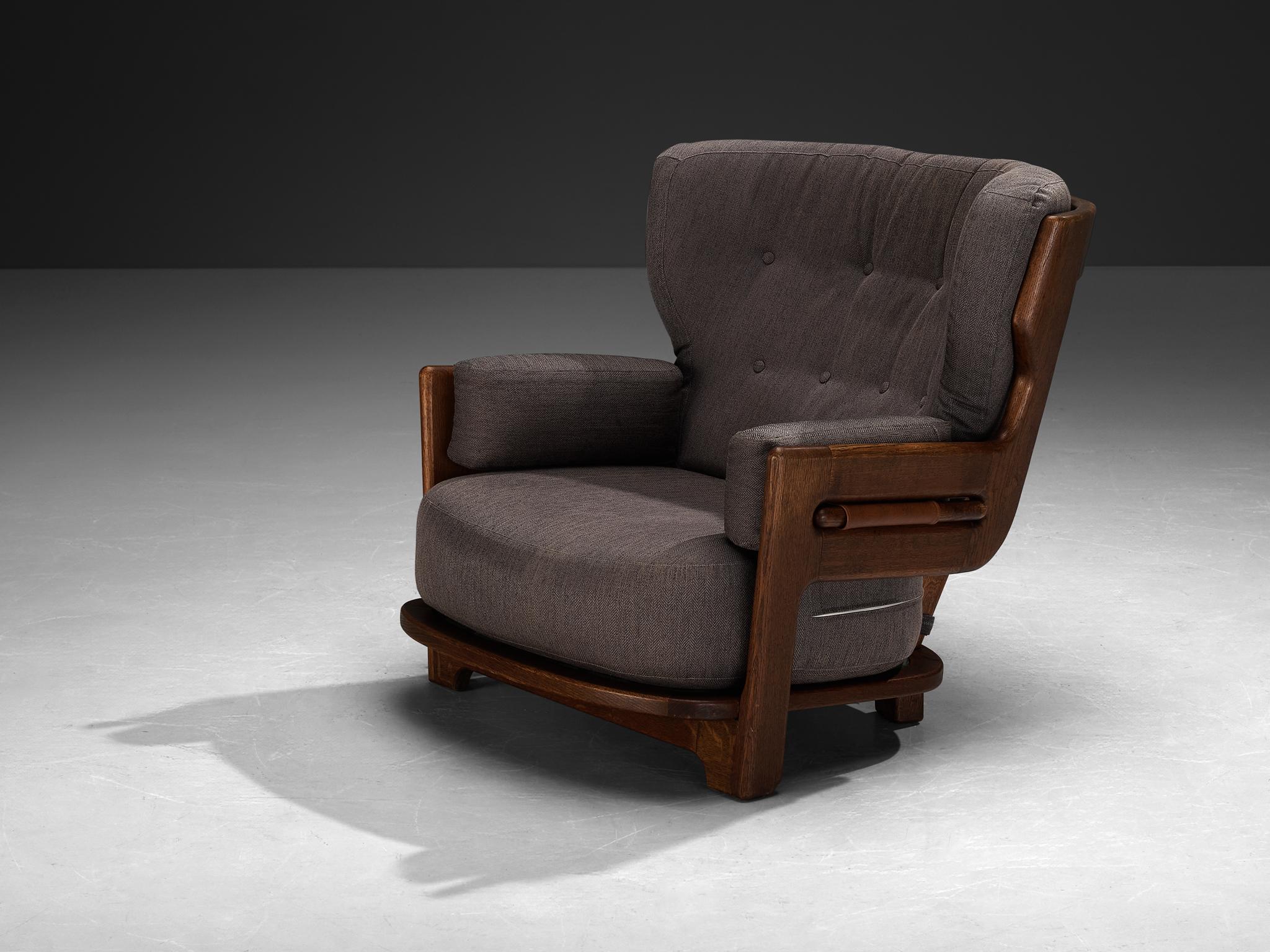 Guillerme et Chambron for Votre Maison, lounge chair 'Denis', fabric, oak, France, 1960s 

Extraordinary Guillerme and Chambron lounge chair in solid oak with the typical characteristic decorative details at the back and capricious forms of the