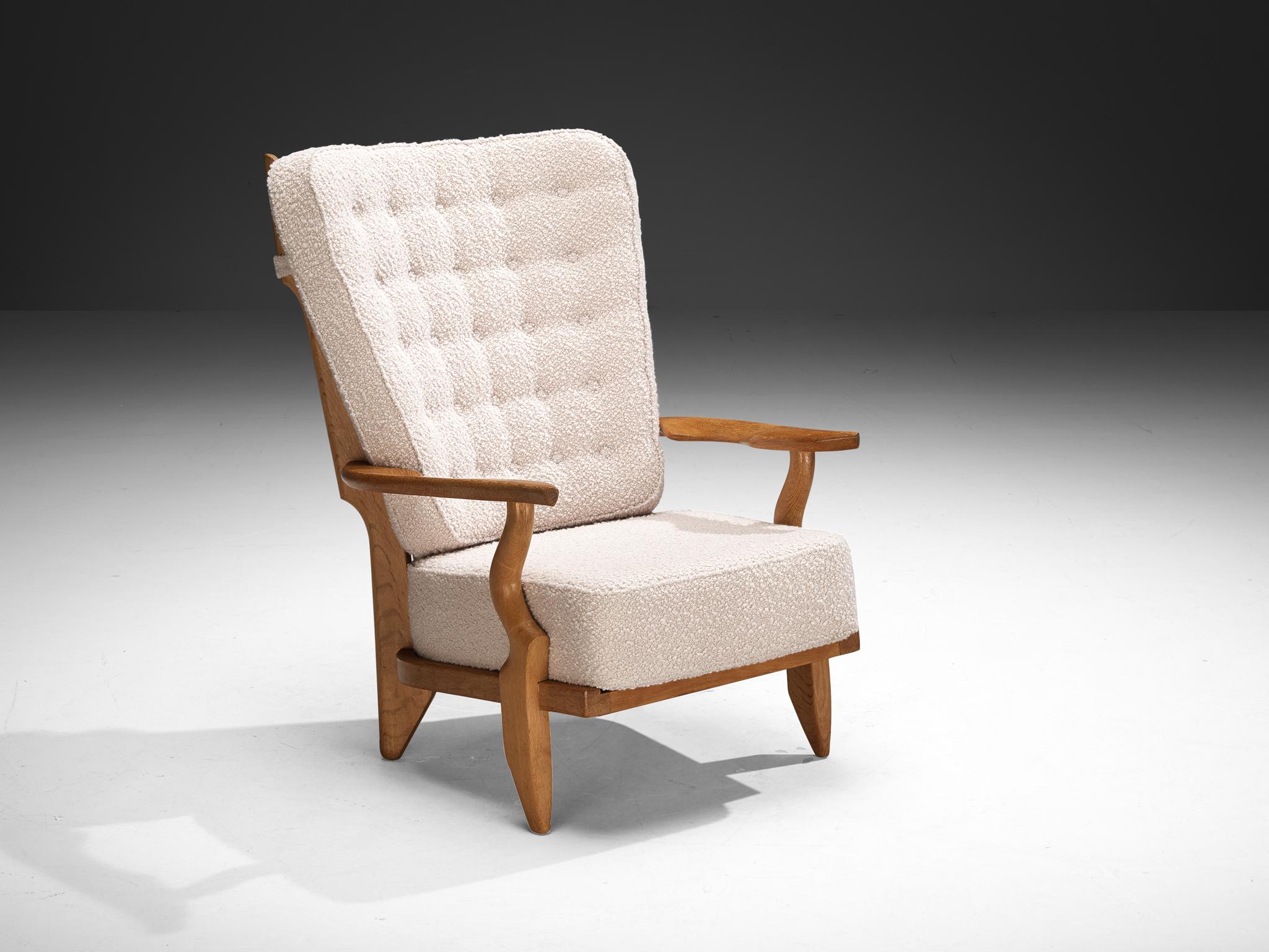 Guillerme et Chambron for Votre Maison, 'Grand Repos' lounge chair, oak, fabric, France, 1960s.

Guillerme & Chambron are known for their high-quality solid oak furniture, of which this is another great example. This chair has an interesting,