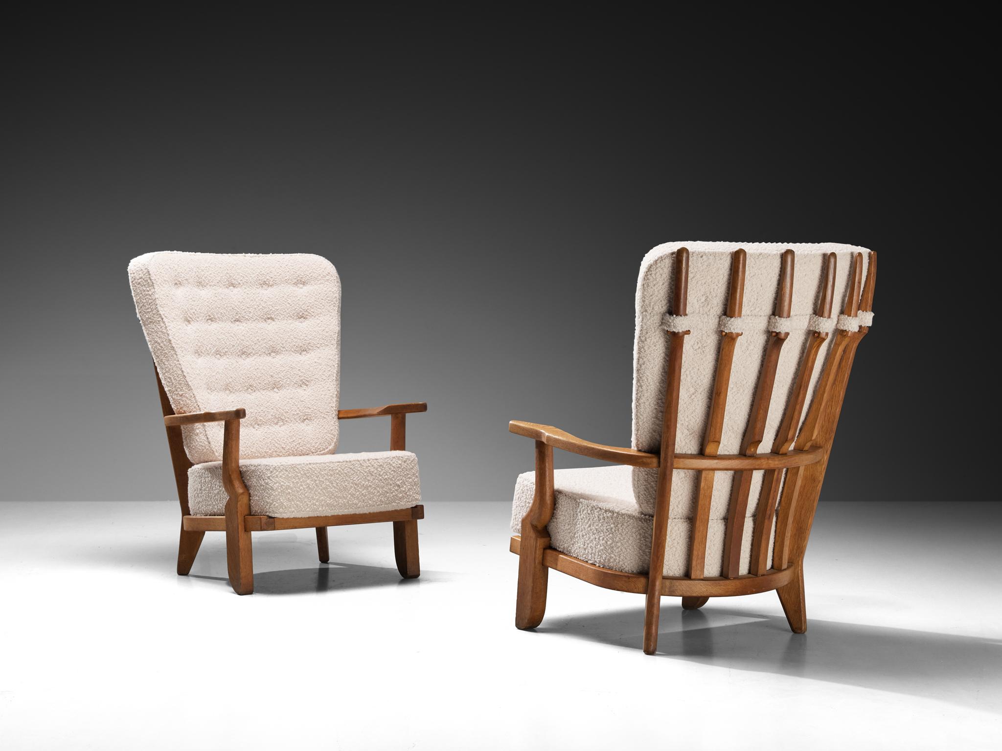 Guillerme et Chambron for Votre Maison, 'Grand Repos' lounge chairs, oak, fabric, France, 1960s.

Guillerme & Chambron are known for their high-quality solid oak furniture, of which this is another great example. This chair has an interesting,