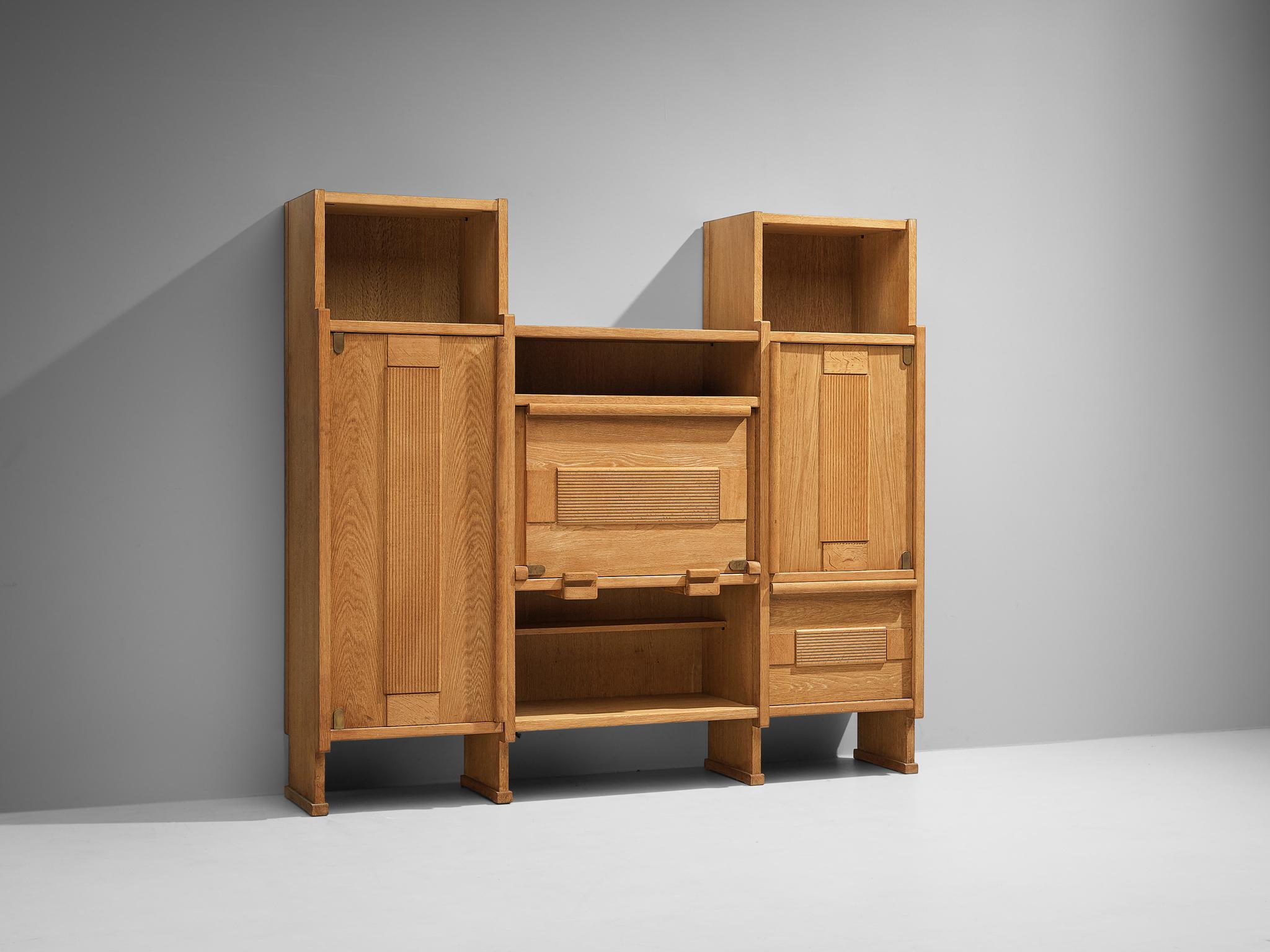 Guillerme et Chambron for Votre Maison, large cabinet, oak, France, 1960s

This excellent and large highboard is a perfect example of the skillfull woodwork by designer duo Guillerme and Chambron. This well constructed and innovative case piece