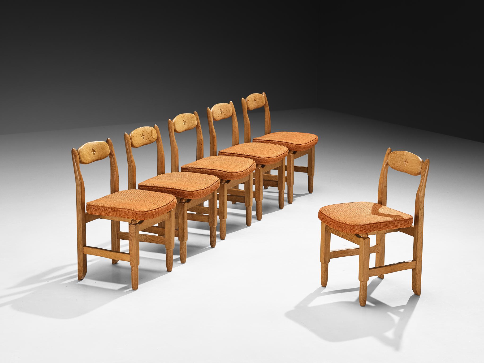 Guillerme et Chambron for Votre Maison, set of six 'Lorraine' dining chairs, fabric, solid oak, France, 1960s.

These distinctive dining chairs, crafted from solid oak, are the work of renowned French design duo Jacques Chambron and Robert
