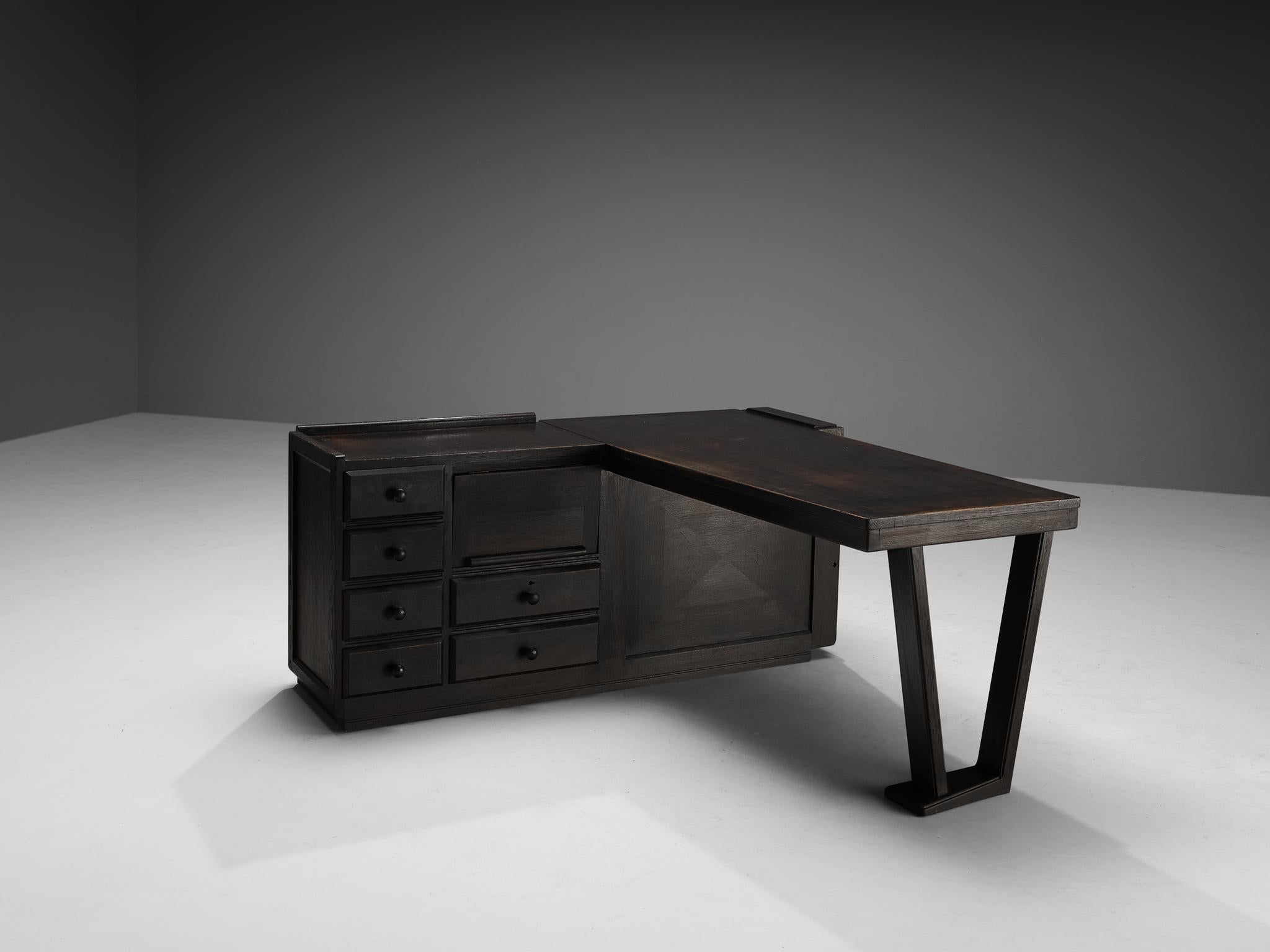 Guillerme et Chambron for Votre Maison, corner desk, stained oak, France, 1960s.

Corner desk by French designer duo Guillerme and Chambron. This executive desk shows the fine craftsmanship that characterizes the work of this designer duo. The desk