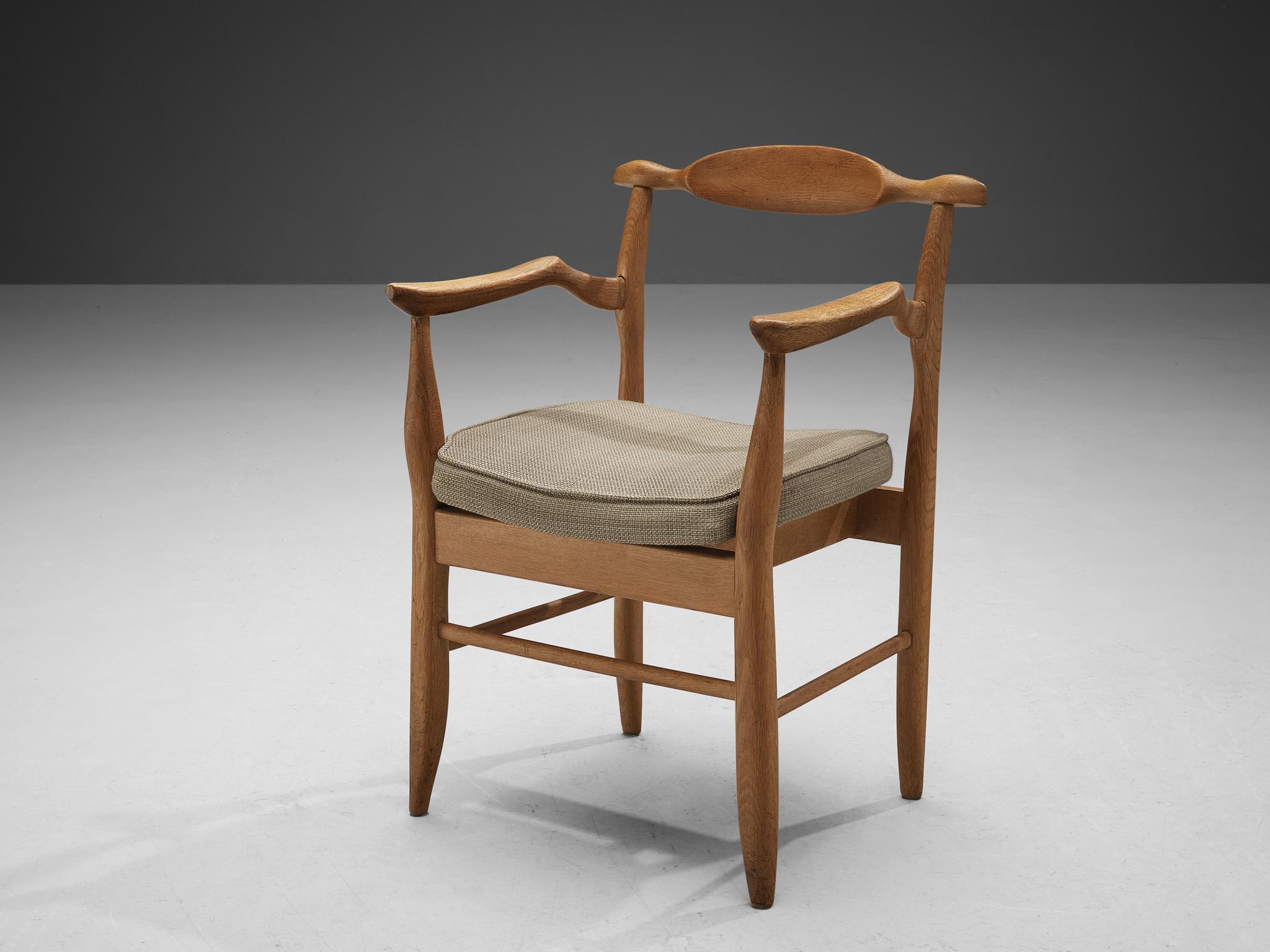 Guillerme et Chambron, armchair model 'Fumay,' oak and fabric, France, 1960s

Beautifully shaped armchair in blond oak by French designer duo Jacques Chambron and Robert Guillerme. This chair shows beautiful lines in every element. Starting with the