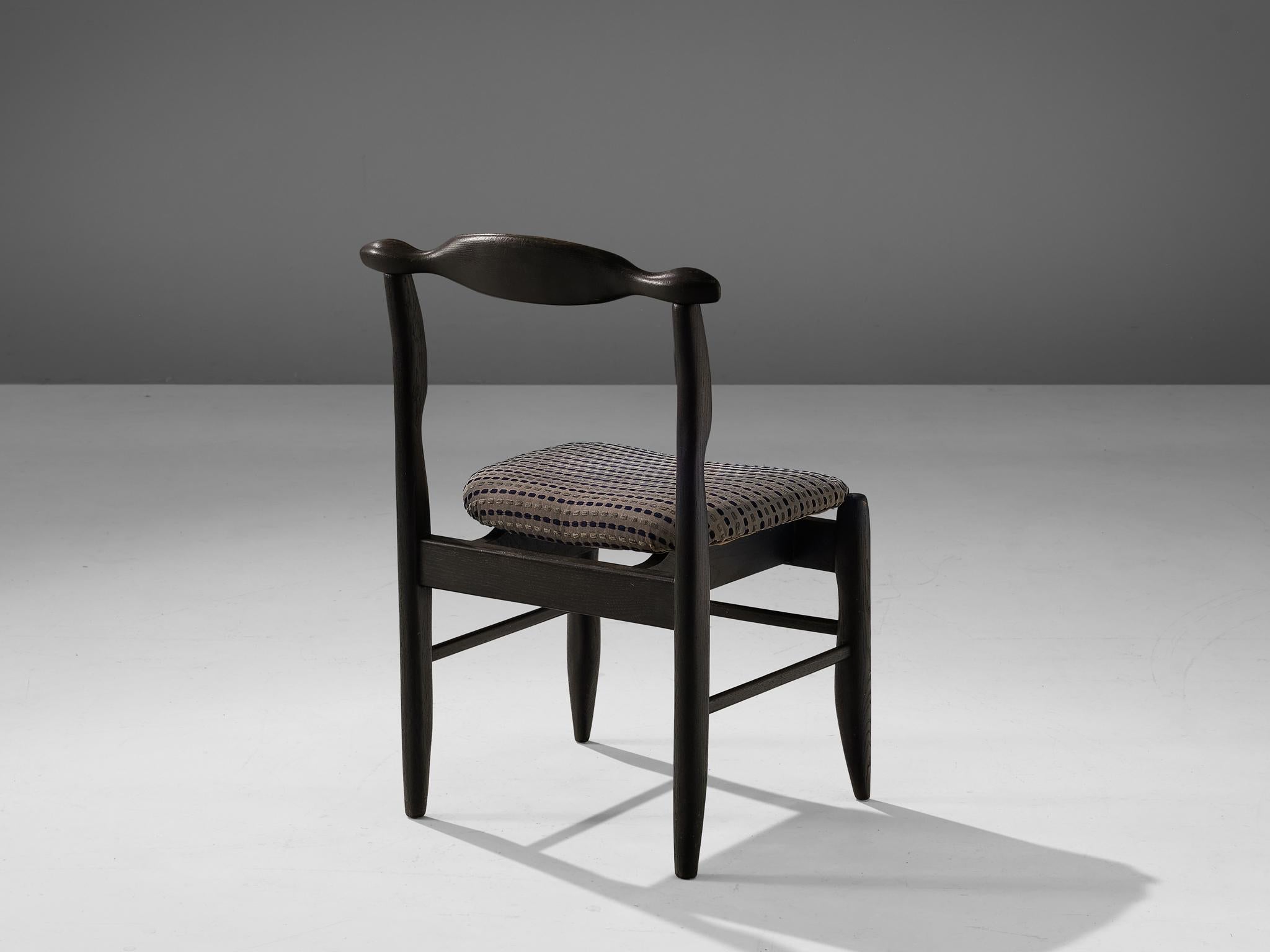Guillerme et Chambron for Votre Maison, dining chair model 'Fumay,' oak and fabric, France, 1960s.

Beautifully shaped chair in darkened oak by French designer duo Jacques Chambron and Robert Guillerme. This dining chair show beautiful lines in