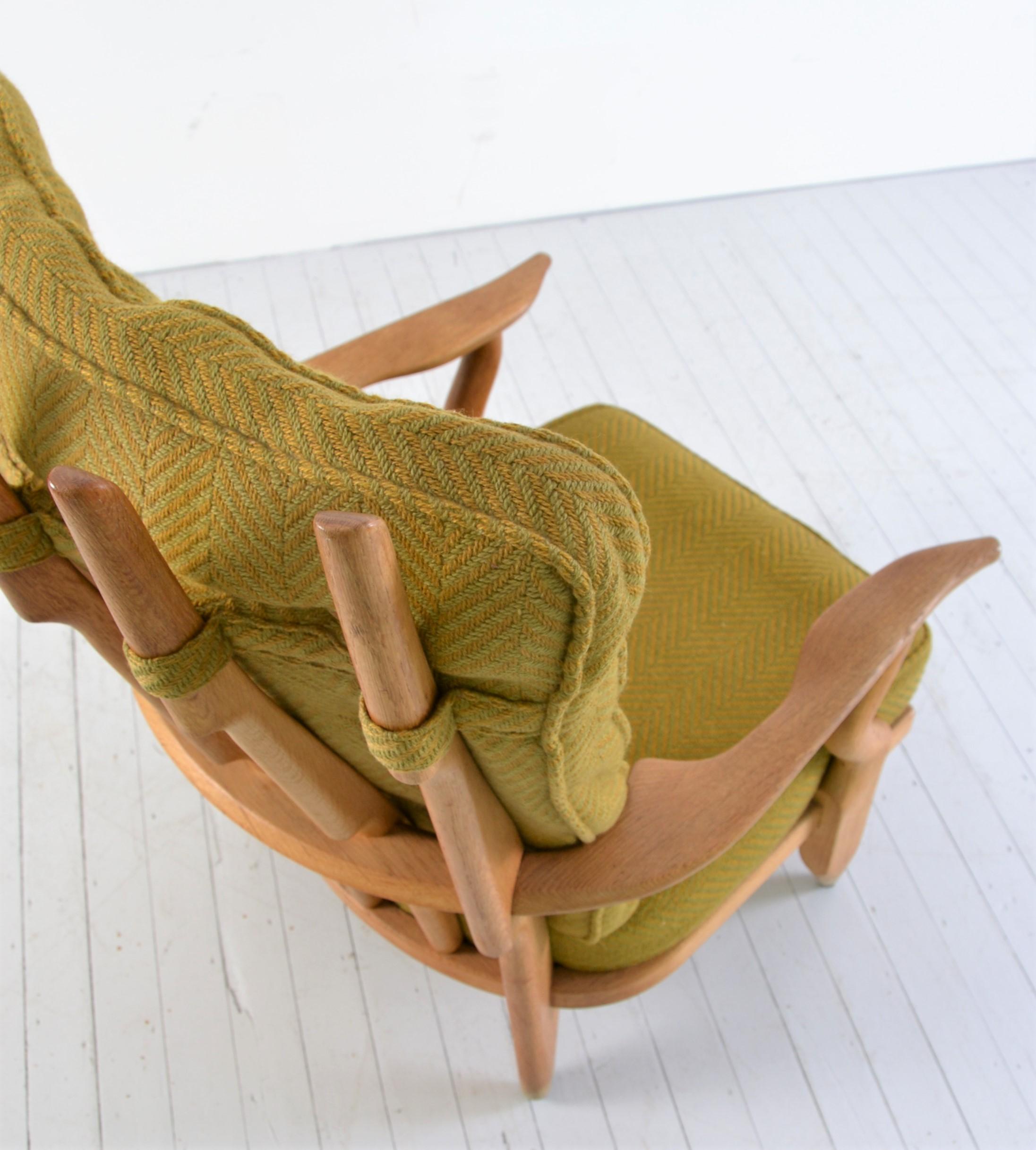 Guillerme et Chambron for Votre Maison, lounge chair model 'Grand Repos', oak, original fabric, France, 1960s.

Well-sculpted Guillerme and Chambron 'Grand Repos' lounge chair in solid oak with the typical characteristic decorative details at the