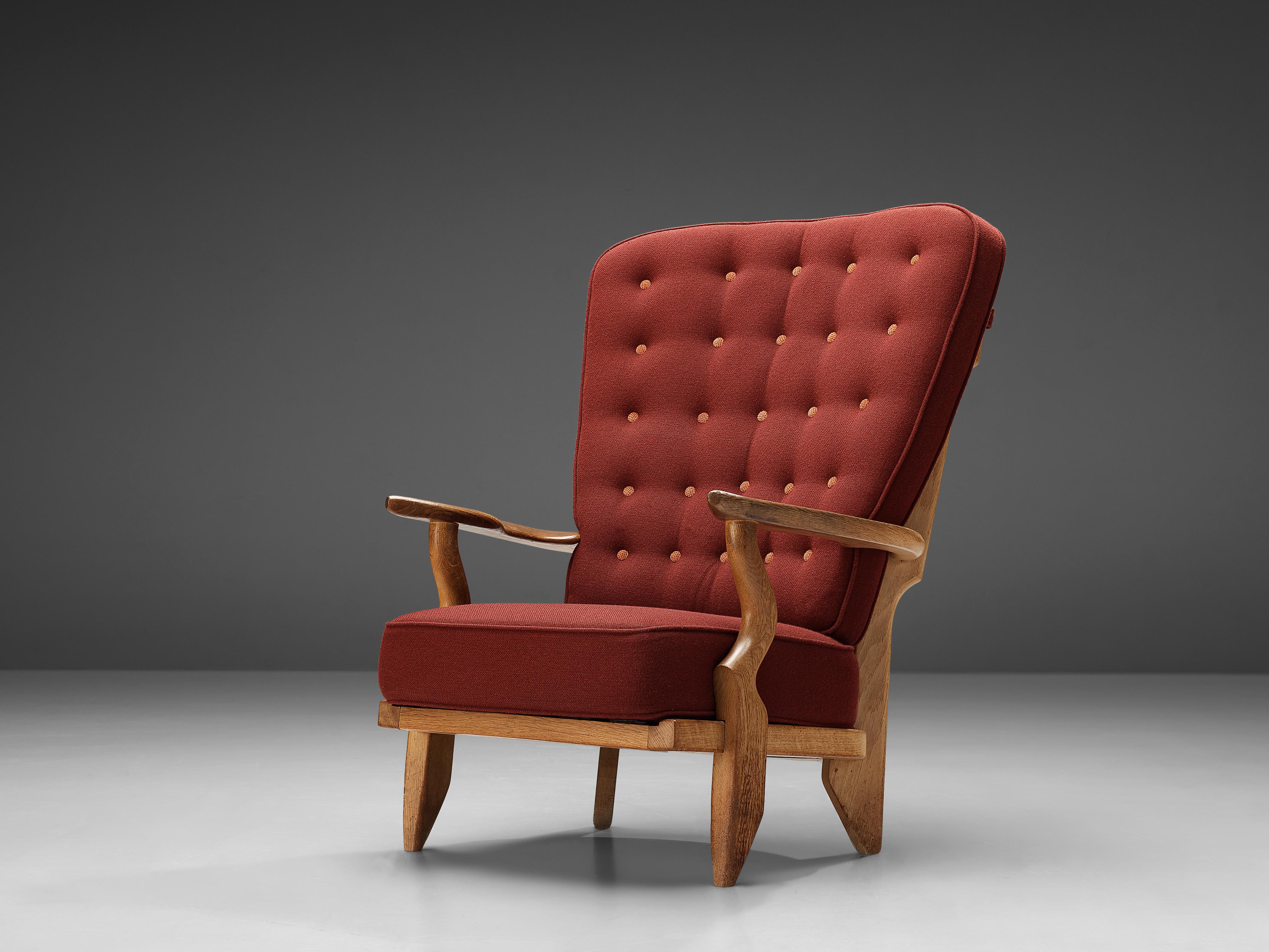Guillerme et Chambron for Votre Maison, 'Grand Repos' lounge chair, oak, burgundy red upholstery, France, 1960s

Guillerme and Chambron are known for their high quality solid oak furniture, from which this is another great example. The chair has an
