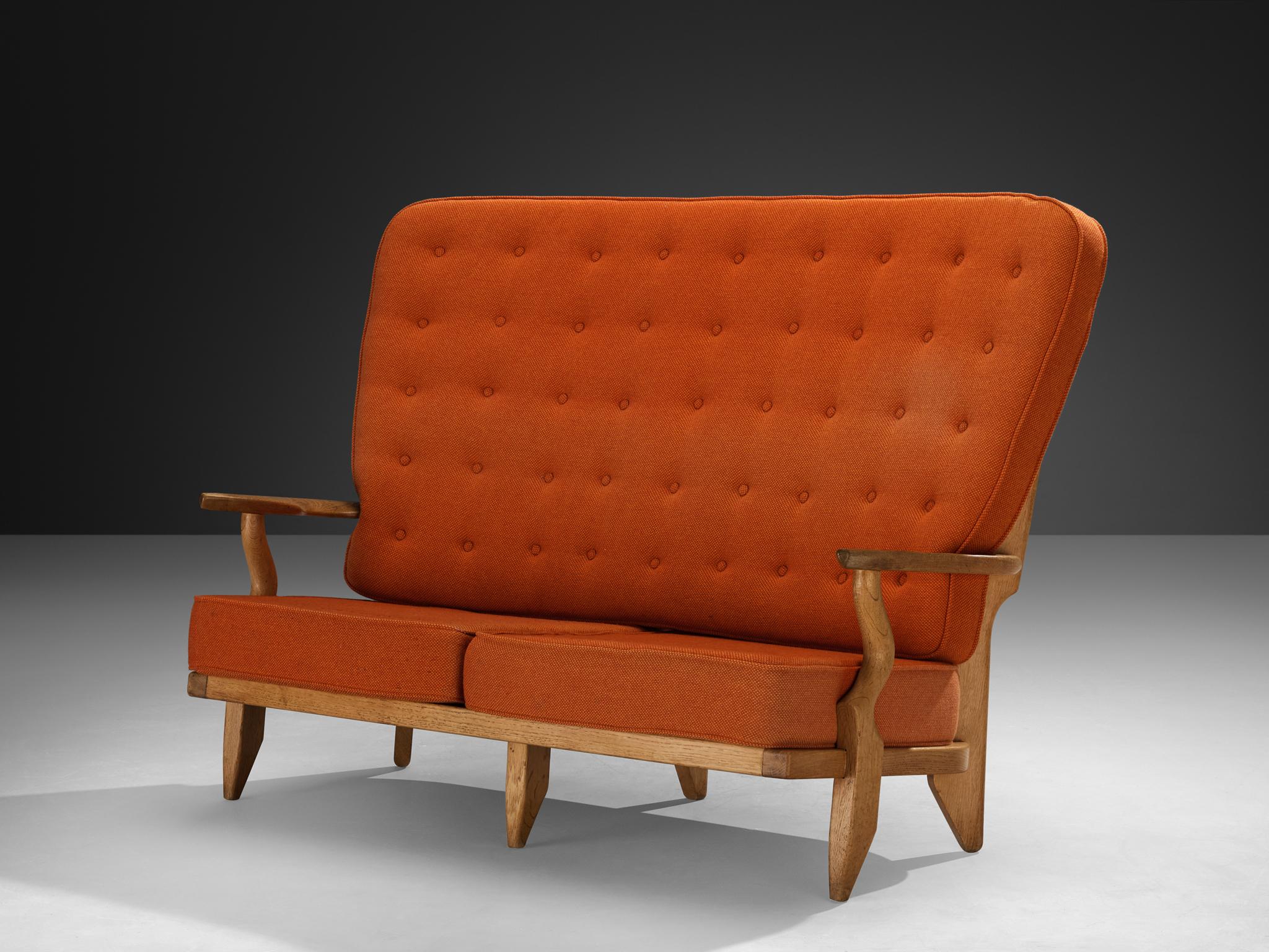 Guillerme & Chambron for Votre Maison, sofa grand repos, fabric, oak, France, 1960s

This sculptural carved oak two-seat sofa is designed by Guillerme and Chambron. The design duo is known for their sculptural, crafted solid oak furniture. This