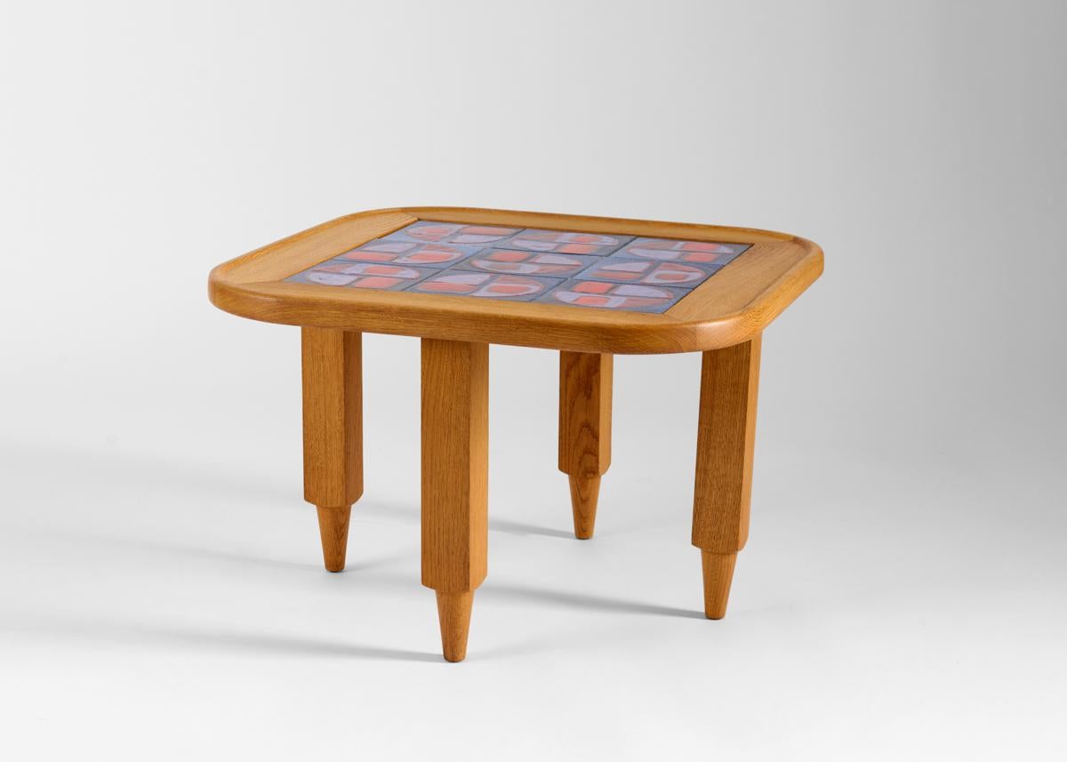 Edition table Gigogne.

Tilework executed by B. Danikowski.

Robert Guillerme placed equal emphasis on function and aesthetics, creating a look as staid as it was arresting. While his work was in many ways distinctively conservative and