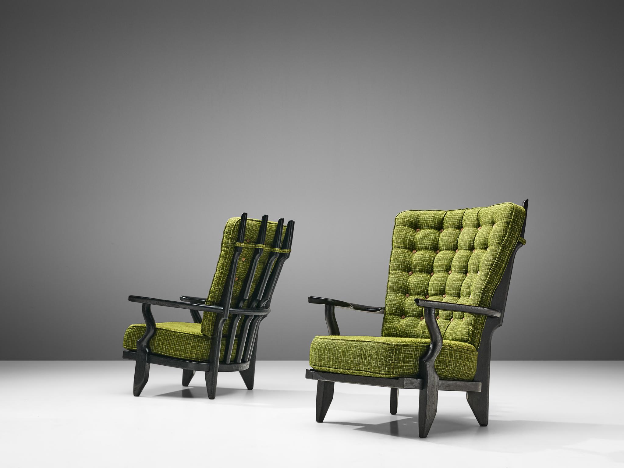 Guillerme et Chambron for Votre Maison, pair of lounge chairs, lacquered oak and green upholstery, France, 1960s. 

Extraordinary Guillerme & Chambron high back lounge chair, in solid black lacquered oak, with the typical characteristic decorative