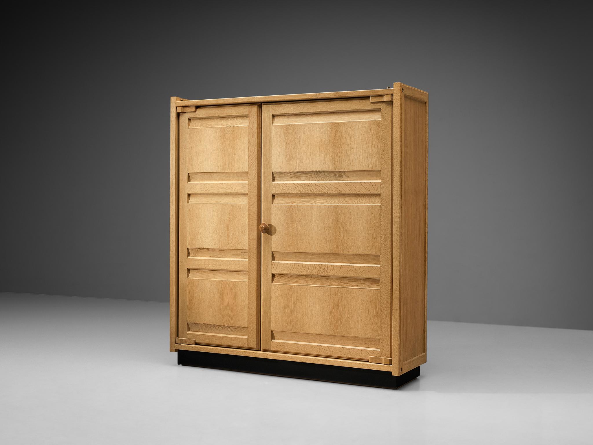 Guillerme et Chambron for Votre Maison, armoire or cabinet, oak, France, 1960s. 

This wardrobe is a good example of excellent woodworking by virtue of the well-designed construction based on innovative wood joints and geometric shapes that create a