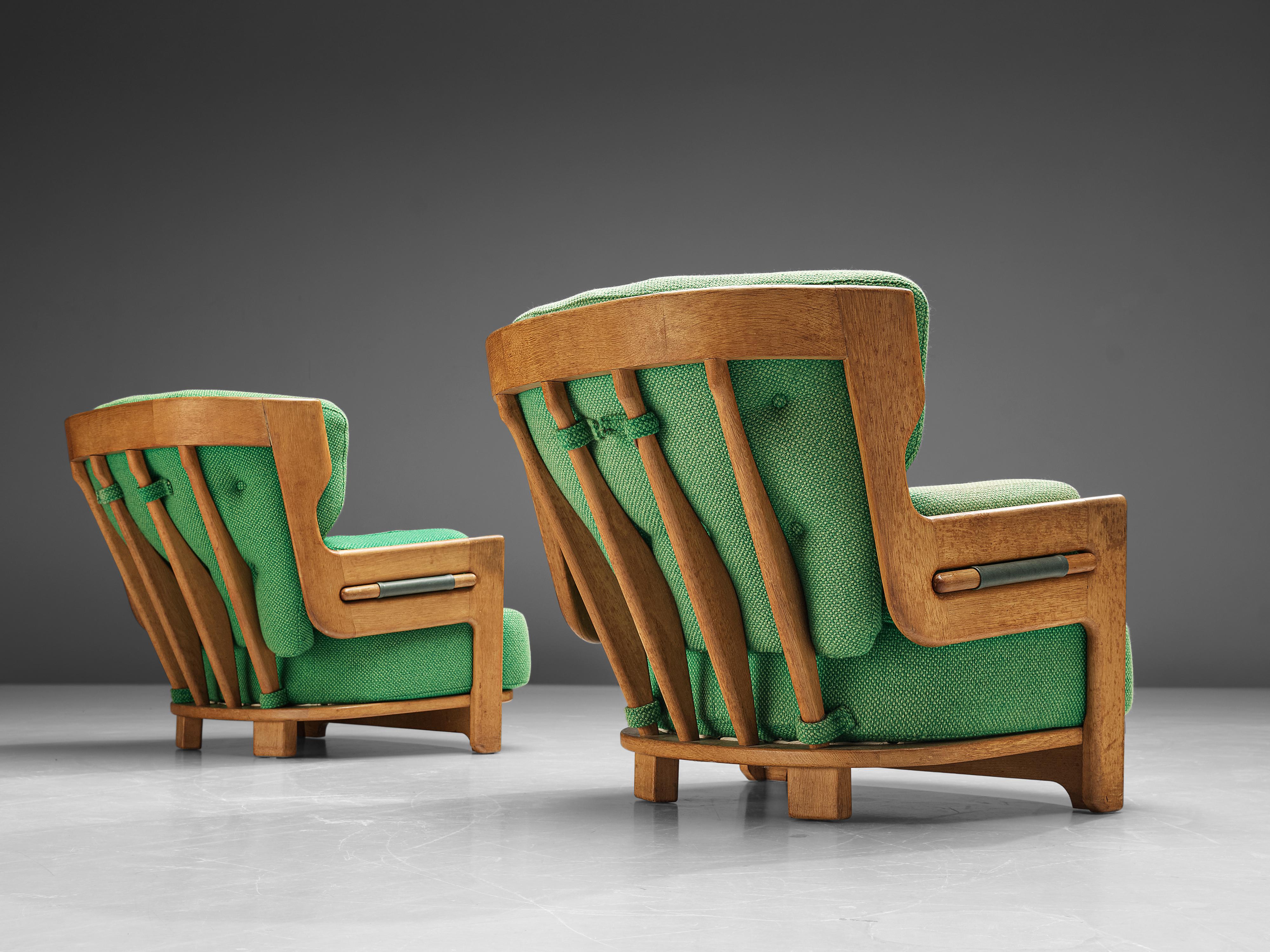 Guillerme & Chambron for Votre Maison, lounge chairs 'Denis', fabric, oak, France, 1960s

Extraordinary Guillerme and Chambron lounge chairs in solid oak with the typical characteristic decorative details at the back and capricious forms of the