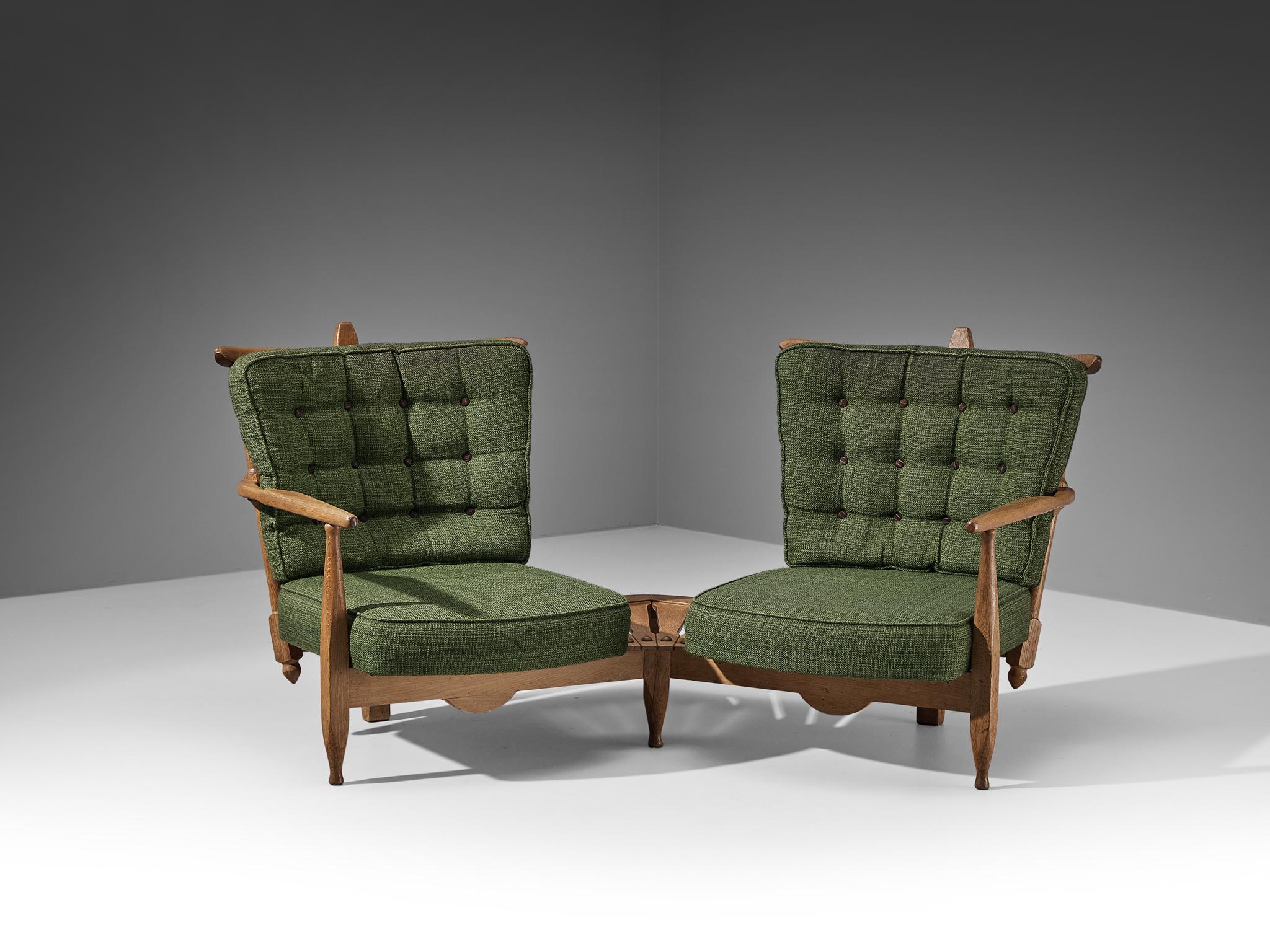 Guillerme et Chambron for Votre Maison, lounge chairs with side table, oak, green fabric, France, 1960s 

Guillerme and Chambron are known for their high quality solid oak furniture, from which this piece is another great example. The curved slatted