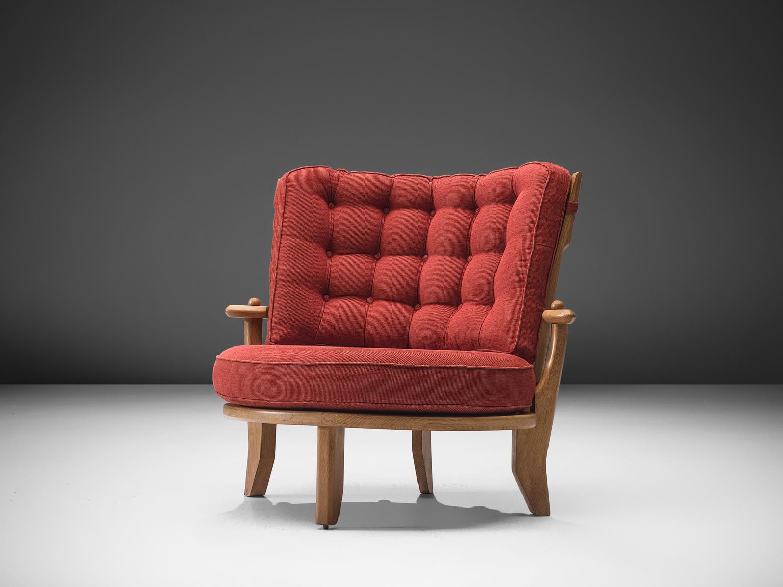 Guillerme et Chambron, lounge chair, oak, red upholstery, France, 1940s. 

This lounge chair or love chair has a classic Guillerme & Chambron style. It is bulky but beautifully made, with attention to detail and comfort. Guillerme and Chambron are