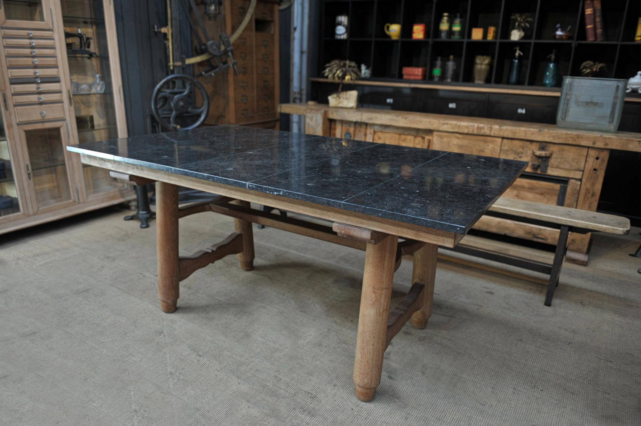 Solid Oak with black stone top dining table from designers: Guillerme & Chambron for Votre Maison ( France) circa 1950, top comes off for shipping total weight 128 kg. Good condition, little scratches on the top.
  