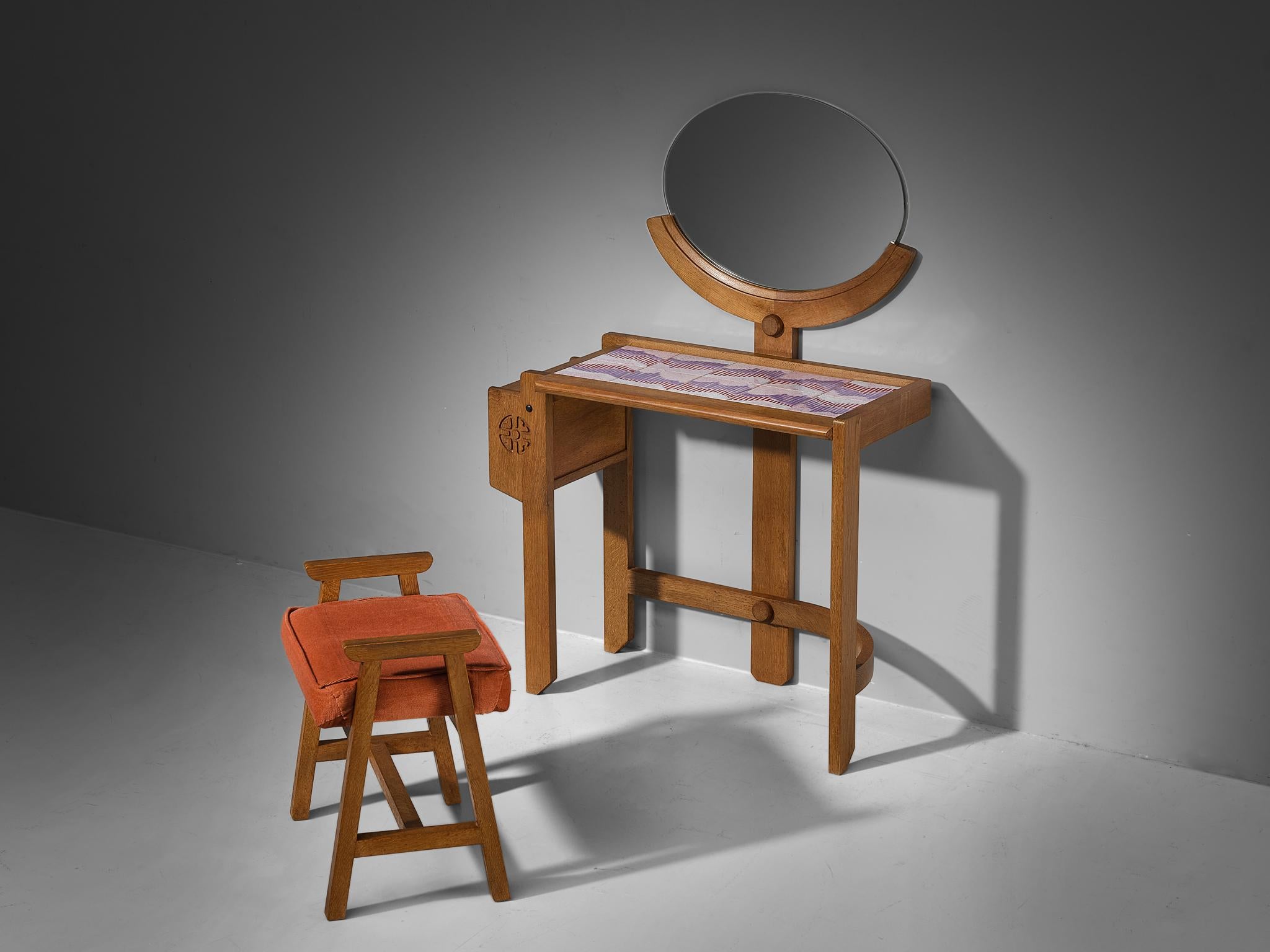 Guillerme et Chambron, vanity table, oak, ceramics, mirror and fabric, France, 1960s.

This dressing table is designed by the French designer duo Guillerme and Chambron. It features their characteristic design elements, such as the decorative