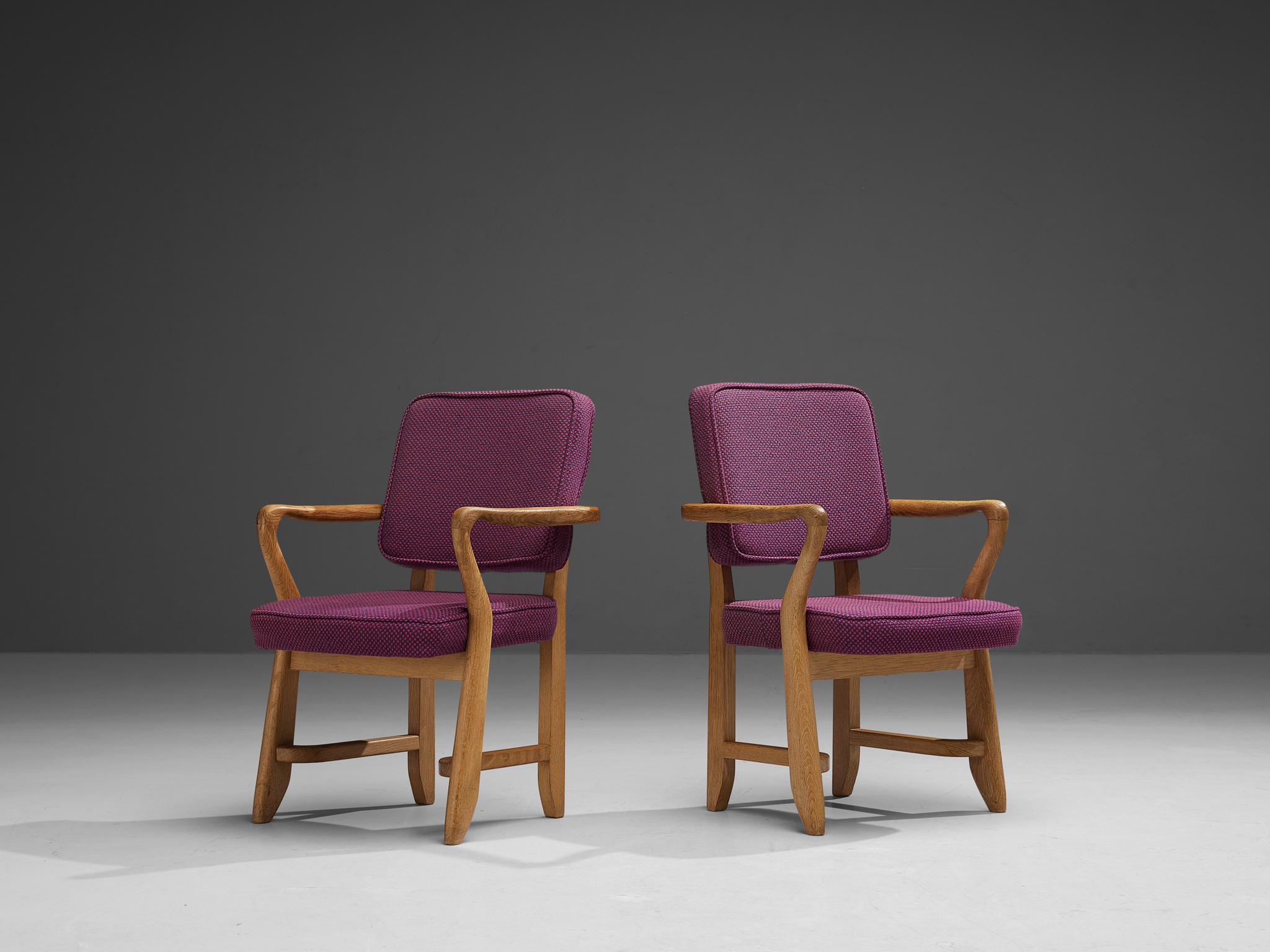 Guillerme et Chambron for Votre Maison, pair of armchairs, model 'Denis', purple fabric, oak, France, 1960s

These sculptural armchairs are designed by Guillerme et Chambron. The duo is known for their high quality solid oak furniture. These