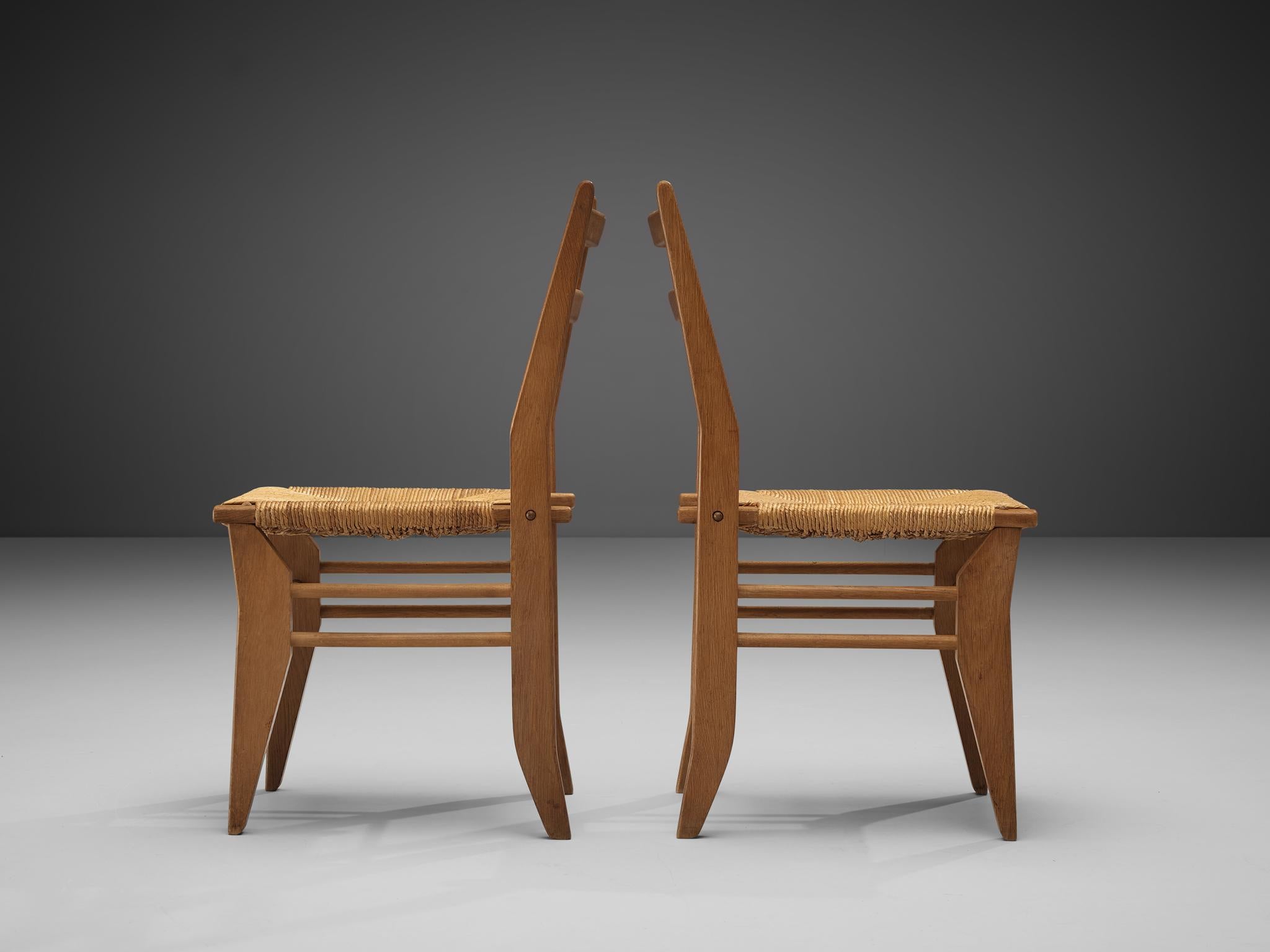 Mid-Century Modern Guillerme & Chambron Pair of Dining Chairs in Oak and Cane