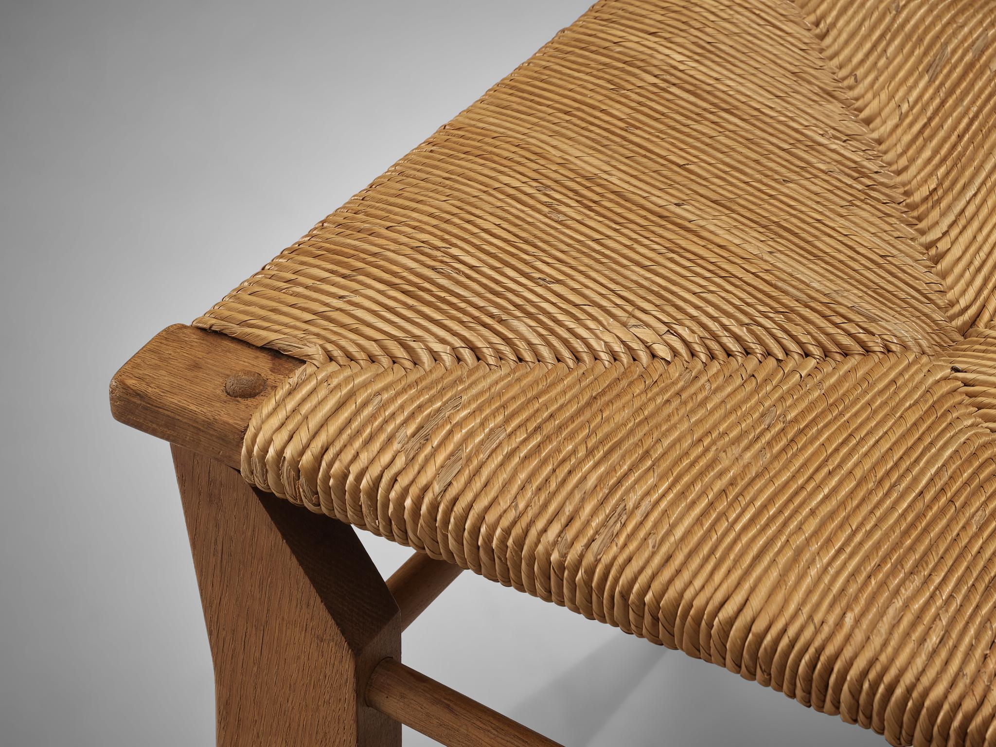 Guillerme & Chambron for Votre Maison, pair of dining chairs, oak, straw, France, 1960s

Pair of elegant dining chairs in solid oak by Guillerme & Chambron. These chairs show the characteristic frame of this French designer duo. Tapered legs and a