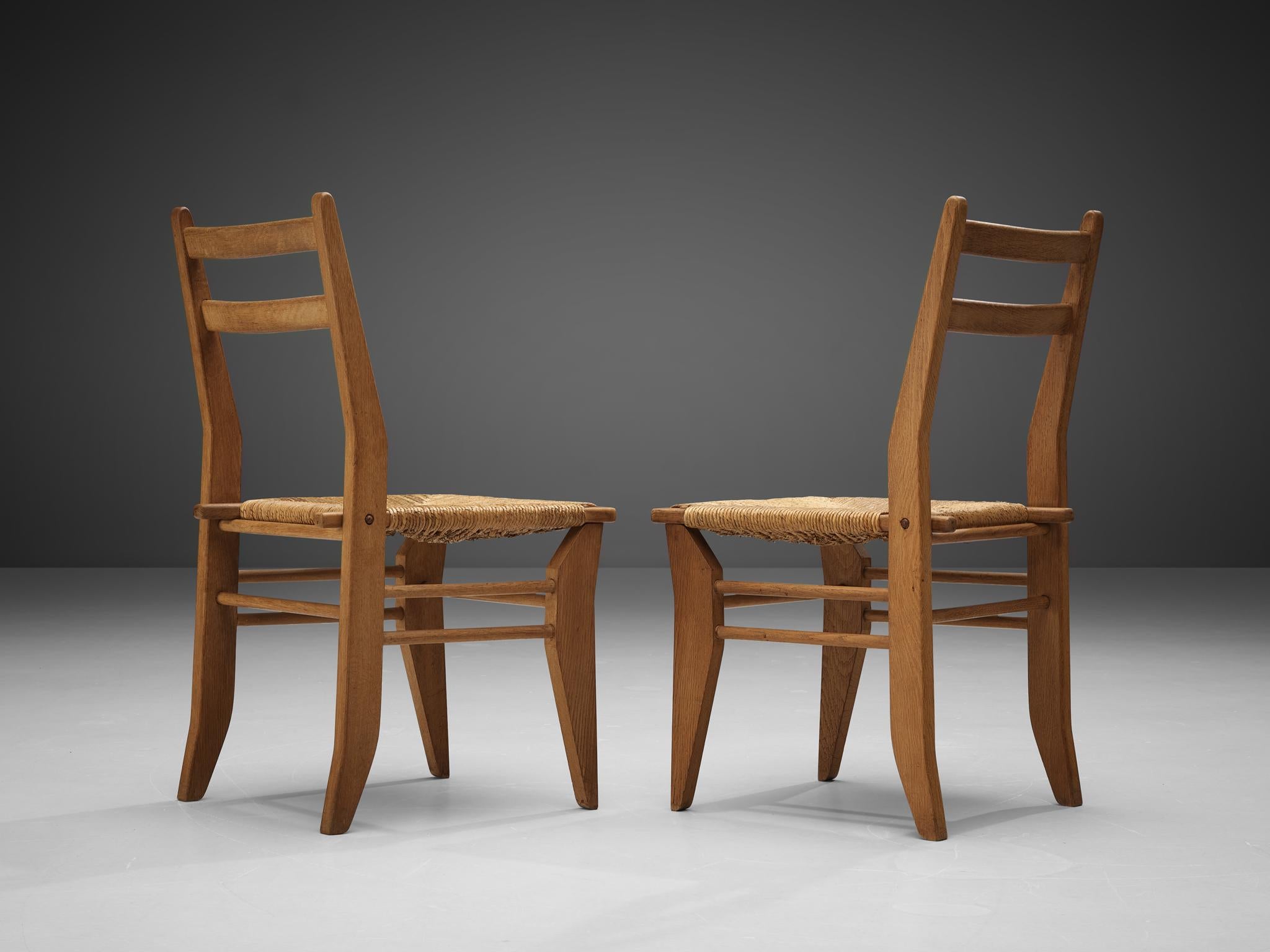 Mid-Century Modern Guillerme & Chambron Pair of Dining Chairs in Oak and Straw For Sale