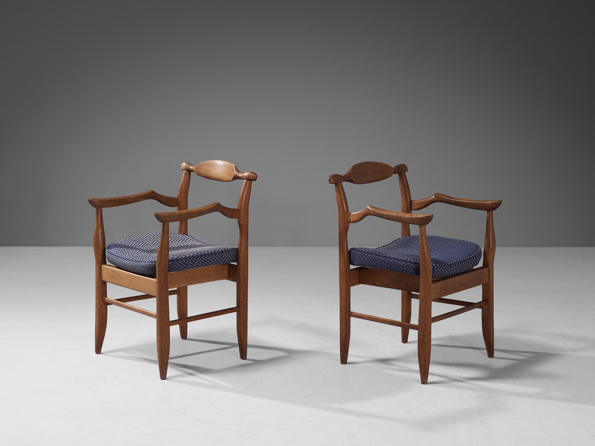 Guillerme et Chambron, pair of armchairs model 'Fumay,' oak and fabric, France, 1965.

Beautiful shaped pair of armchairs in blond oak by French designer duo Jacques Chambron and Robert Guillerme. This chair shows beautiful lines in every element.