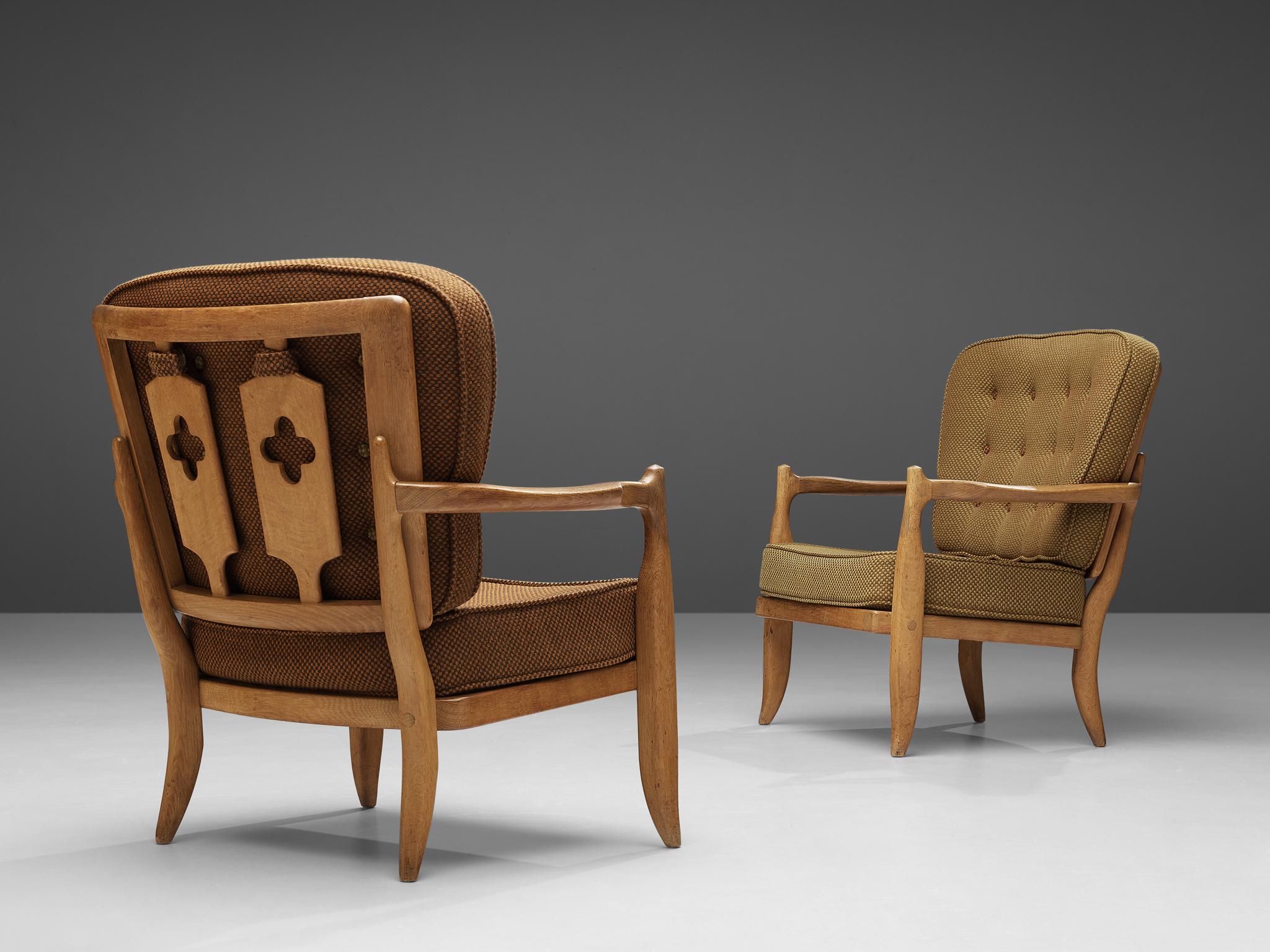 Guillerme and Chambron for Votre Maison, pair of easy chairs model ‘Jose’, oak, fabric upholstery, France, 1960s

Characteristic pair of lounge chairs by French designer duo Guillerme et Chambron. While the front of these lounge chairs convinces