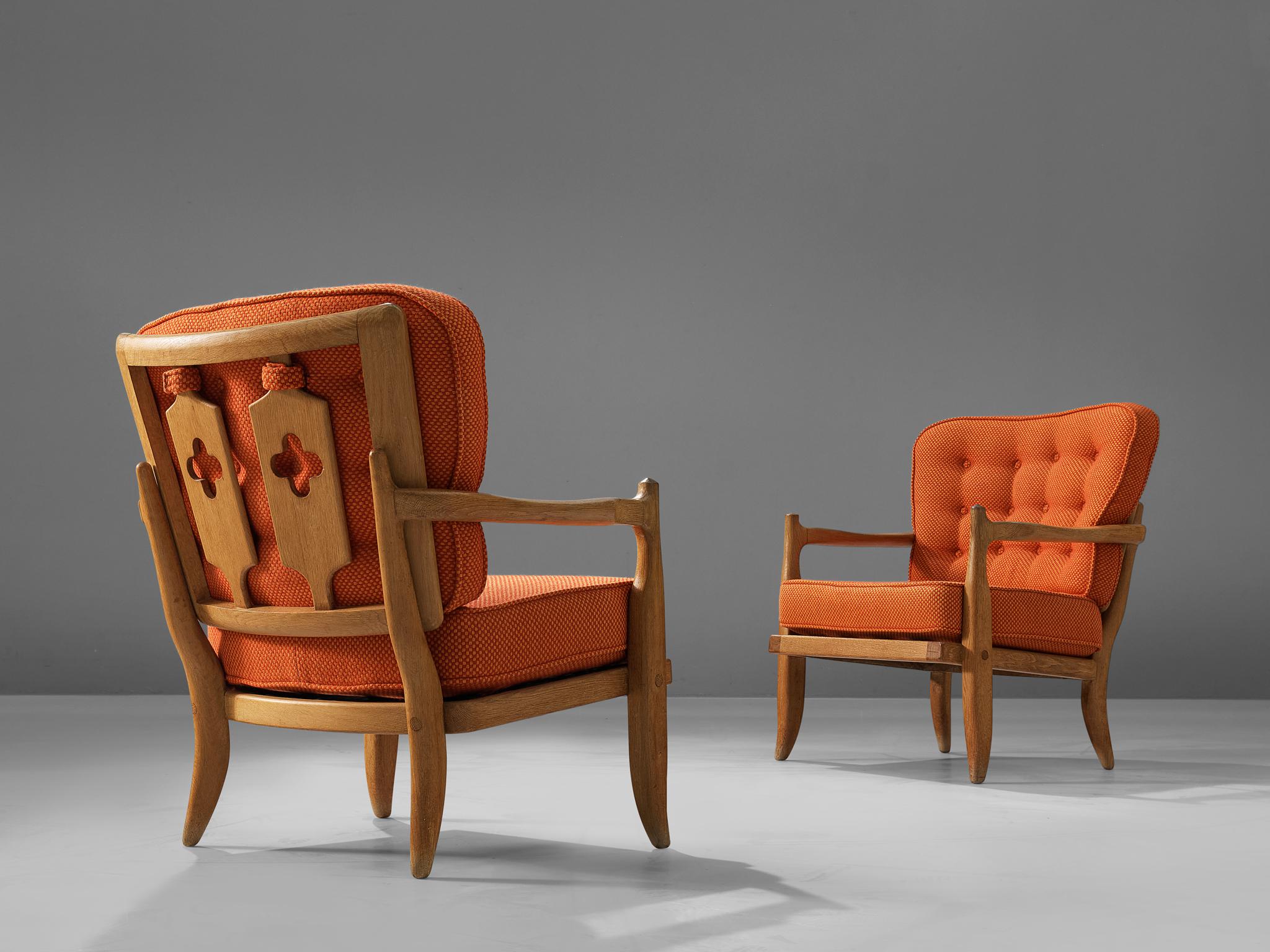 Guillerme & Chambron for Votre Maison, pair of easy chairs model ‘Jose’, oak, orange fabric, France, 1960s

Characteristic pair of armchairs by French designer duo Guillerme & Chambron. While the front convinces with its clear appearance, the