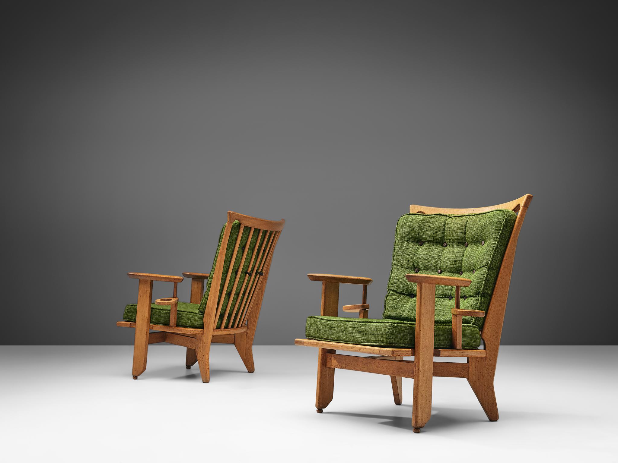 Guillerme et Chambron for Votre Maison, pair of lounge chairs, fabric, oak, France, 1960s

This French designer duo is known for their extreme high quality solid oak furniture, from which this set is another great example. These chairs have a very