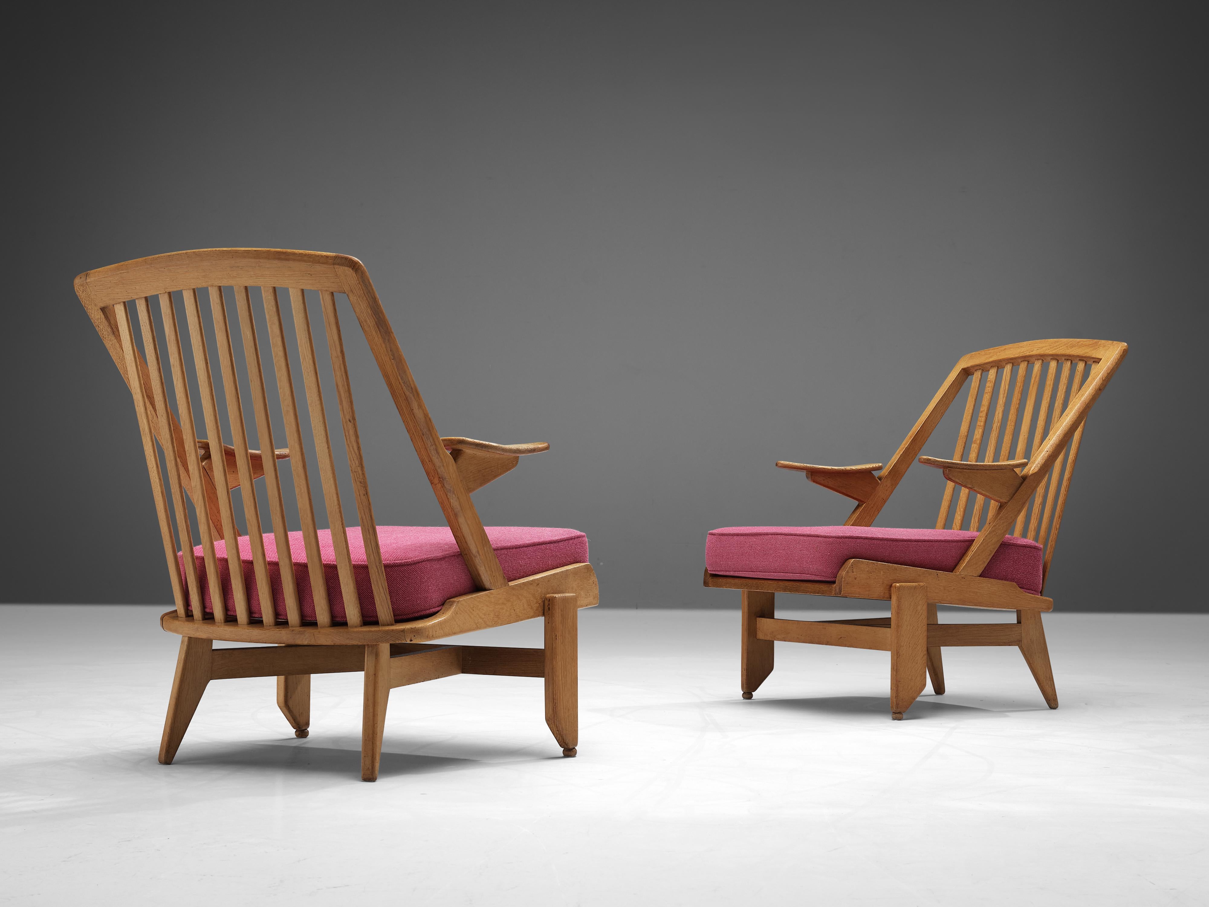 Guillerme et Chambron, pair of lounge chairs, pink fabric, oak, France, 1960s

This French designer duo is known for their extremely high-quality solid oak furniture, from which this set is another great example. These chairs have a very interesting