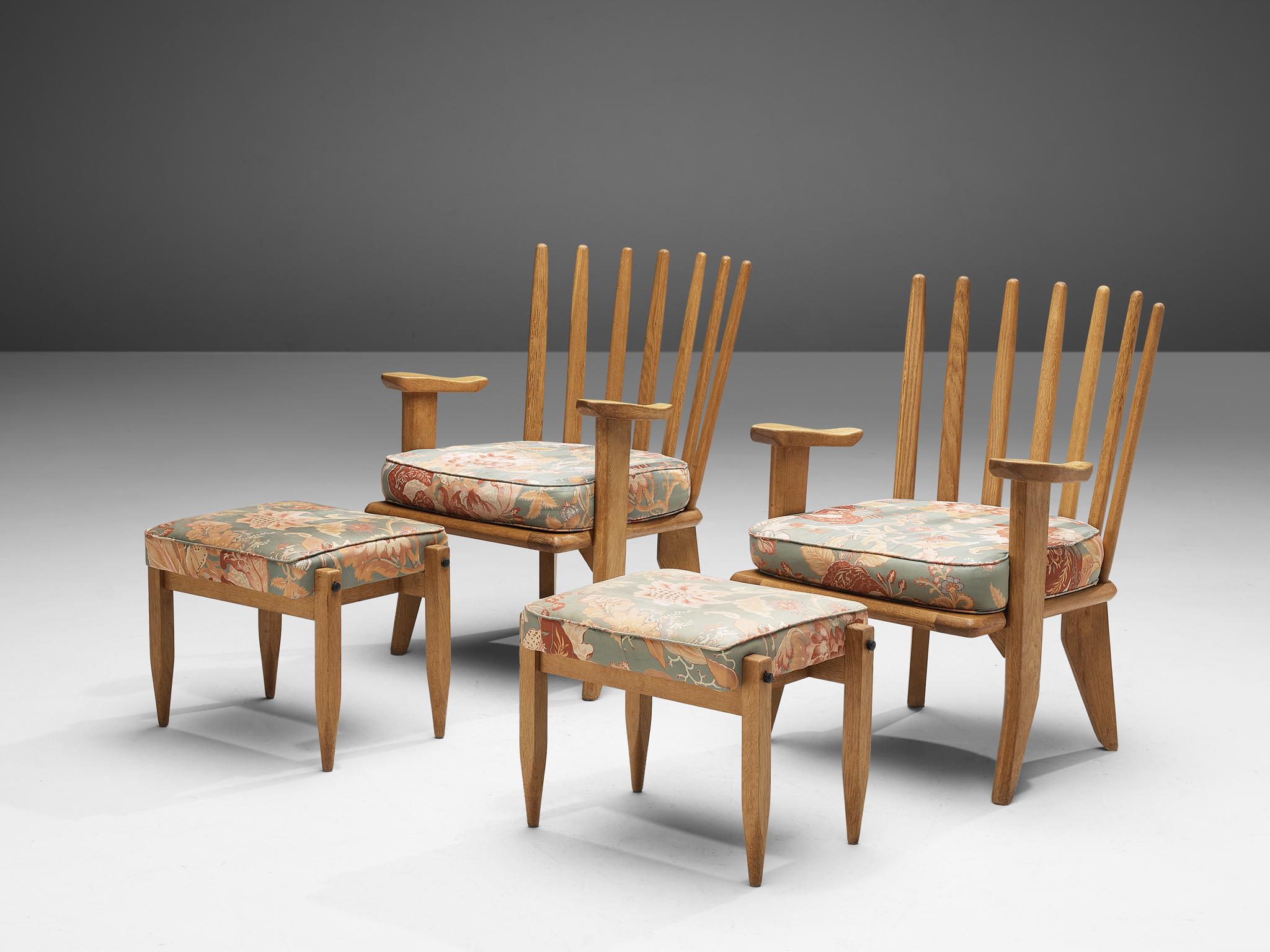 Guillerme & Chambron, set of four lounge chairs, in oak and fabric, France, 1960s. 