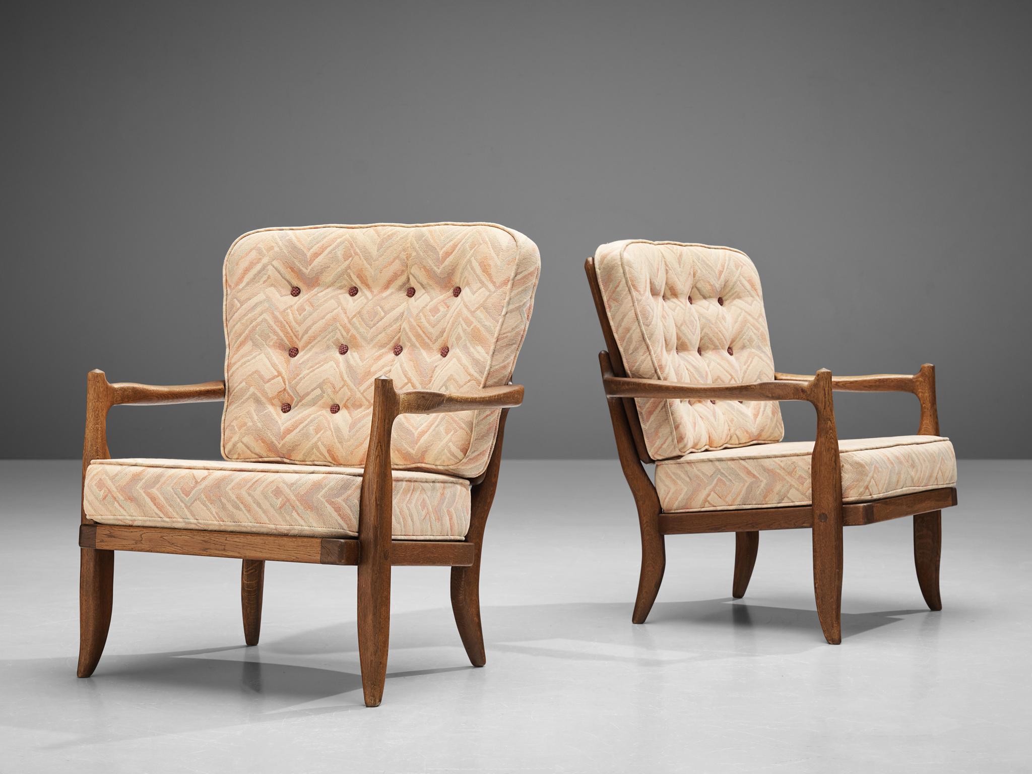 French Guillerme & Chambron Pair of ‘Jose’ Lounge Chairs in Oak