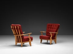 Guillerme & Chambron, coppia di poltrone "Petit Repos" in rovere massiccio