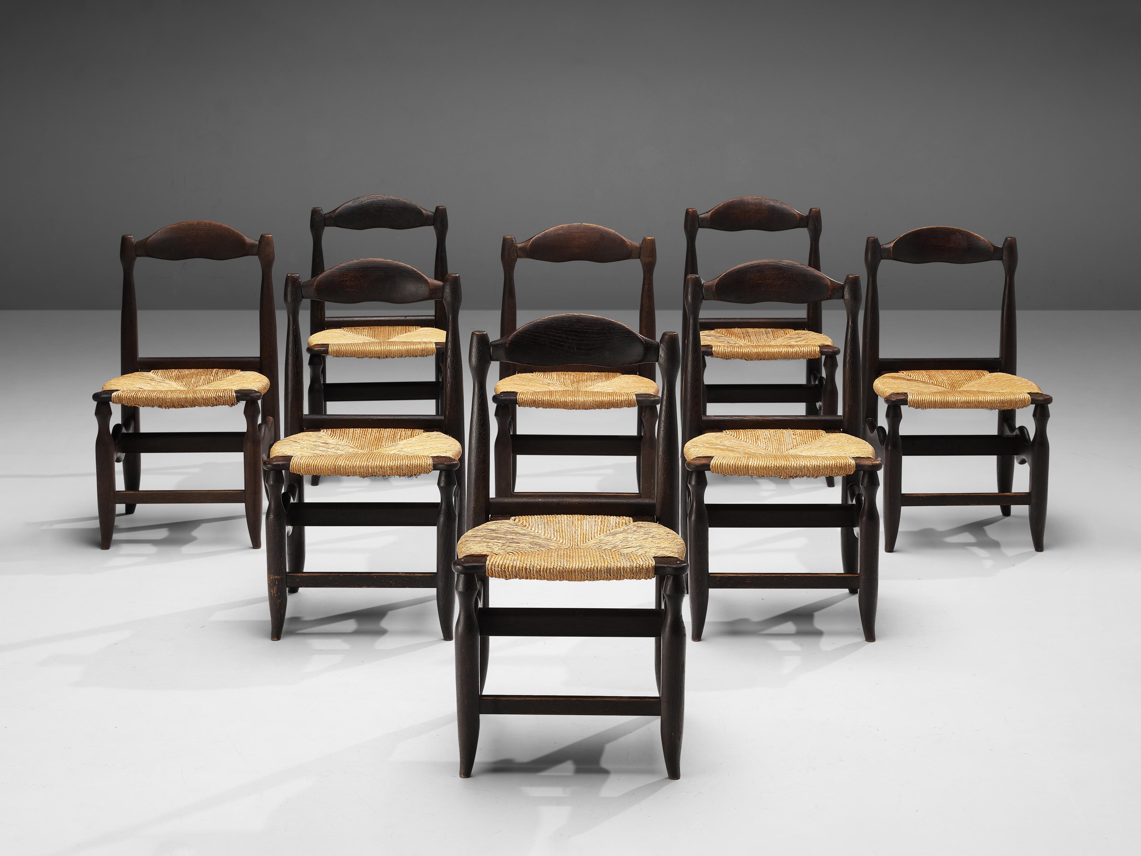 Guillerme & Chambron for Votre Maison, set of eight dining chairs, oak, rush, France, 1960s

Beautifully shaped chairs in patinated oak by French designer duo Jacques Chambron and Robert Guillerme. These dining chairs show beautiful lines in every