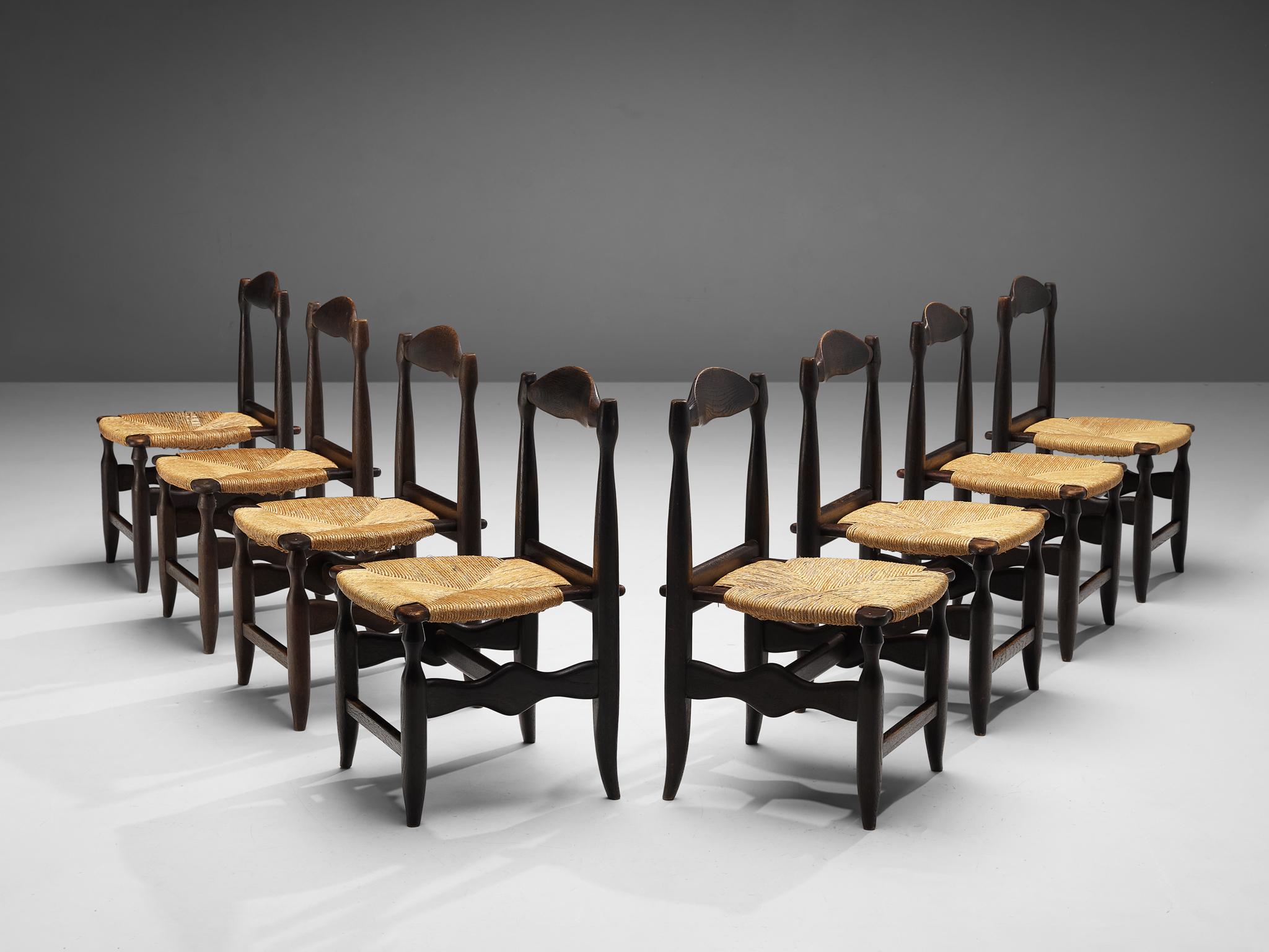 Guillerme & Chambron for Votre Maison, set of eight dining chairs, oak, rush, France, 1960s

Beautifully shaped chairs in patinated oak by French designer duo Jacques Chambron and Robert Guillerme. These dining chairs show beautiful lines in every