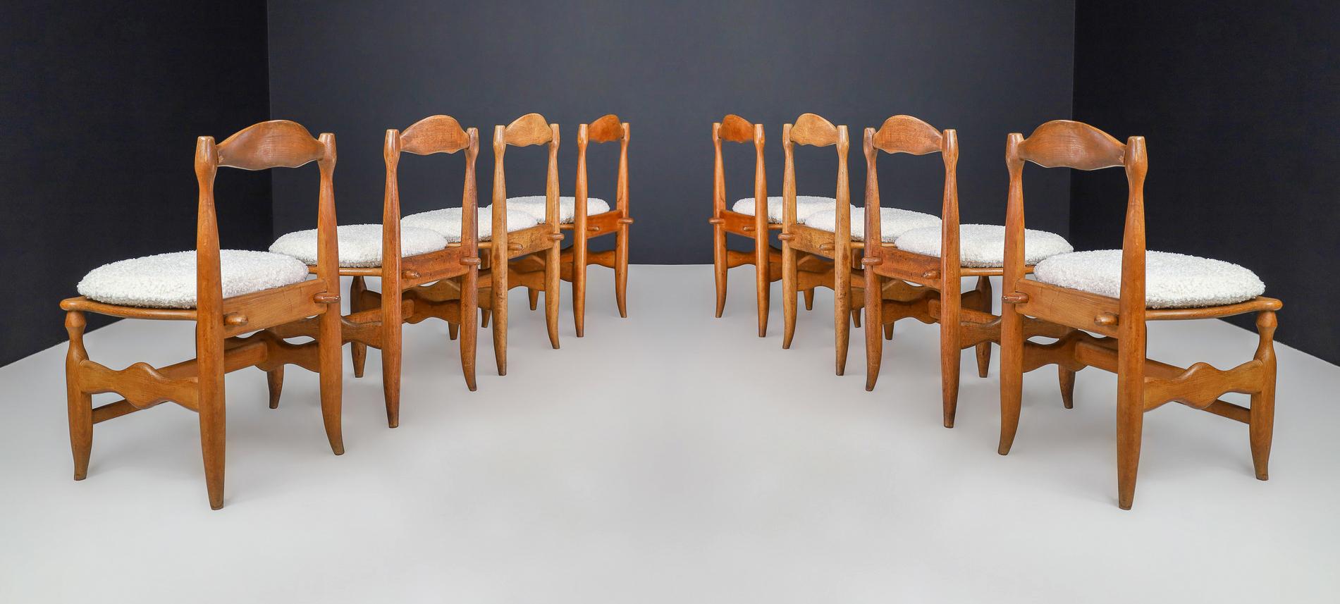 Mid-Century Modern Guillerme & Chambron Set of Eight dining room chairs in Oak and Bouclé France  For Sale