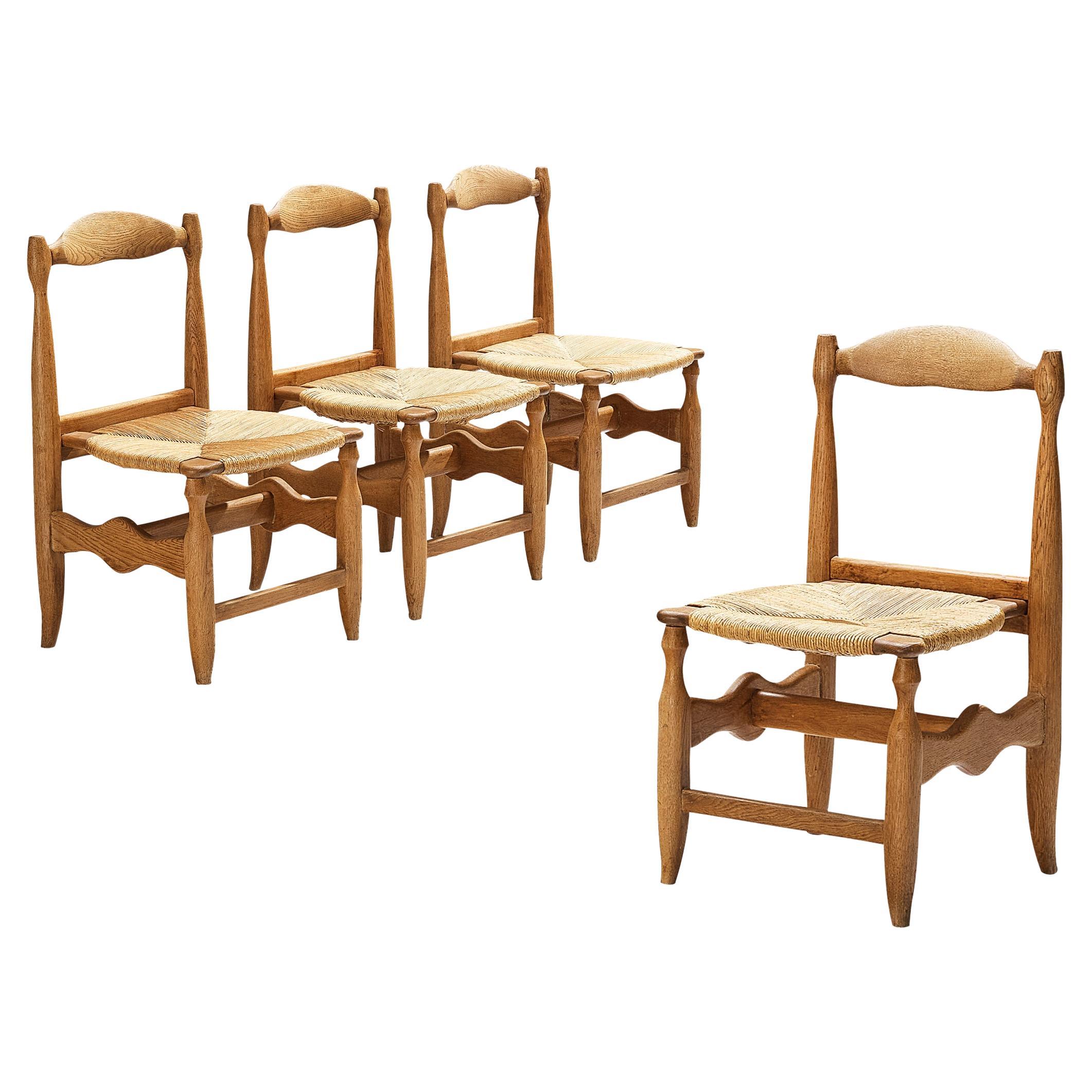 Guillerme & Chambron Set of Four 'Charlotte' Dining Chairs in Oak and Straw For Sale