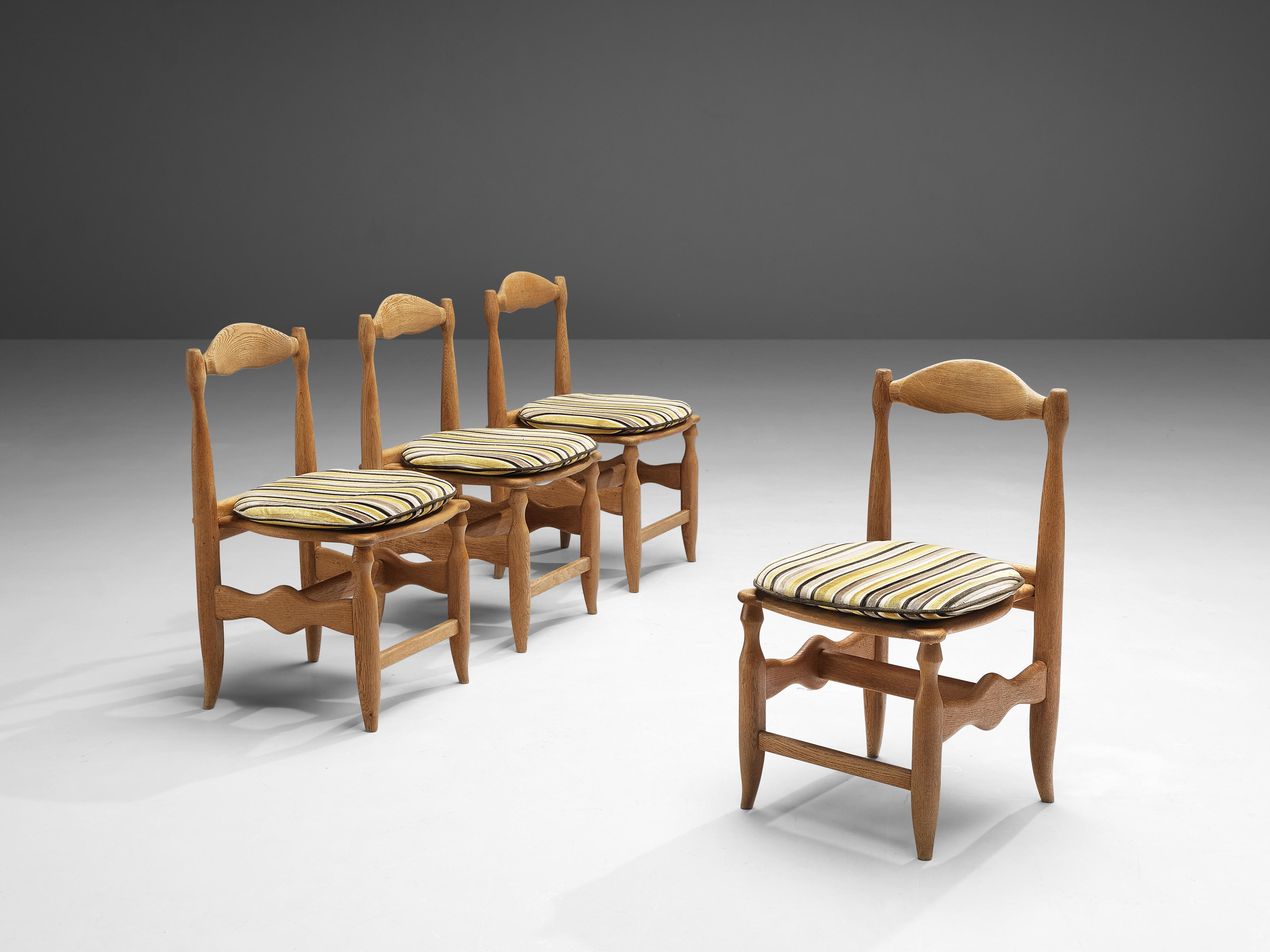 Guillerme et Chambron for Votre Maison, set of four dining chairs, oak, fabric, France, 1960s

Beautifully shaped chairs in patinated oak by French designer duo Jacques Chambron and Robert Guillerme. These dining chairs show beautiful lines in every